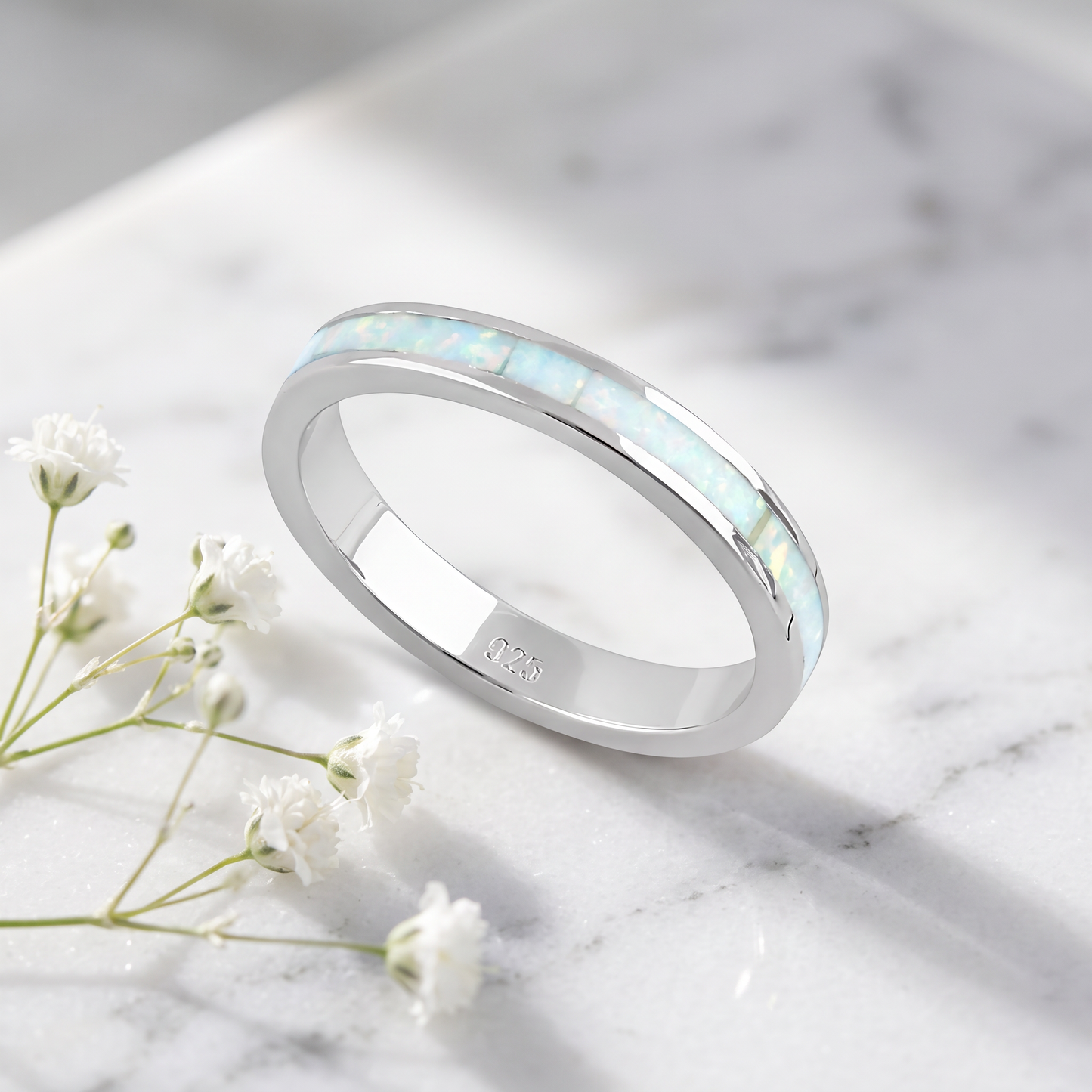 Sterling Silver White Lab-Opal Seamless Eternity Ring on marble