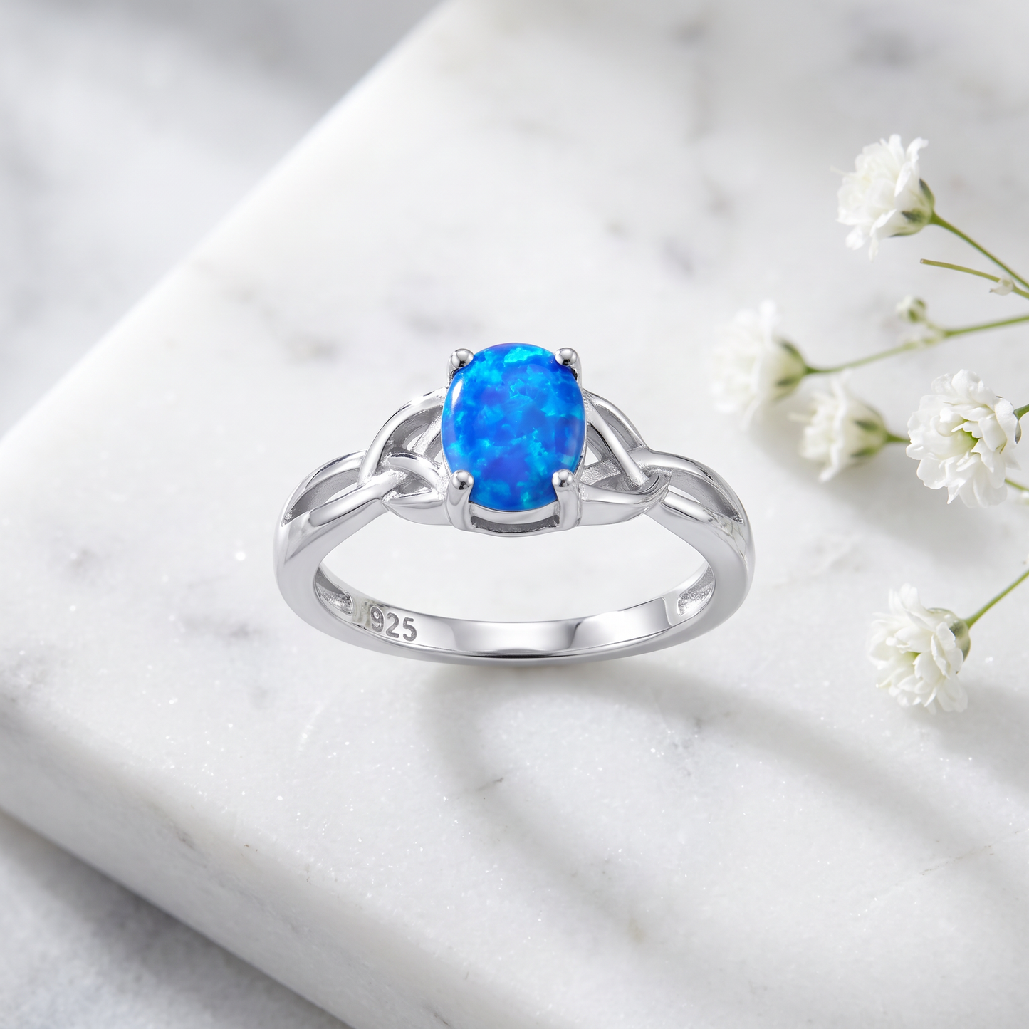 Sterling Silver Gold Plated Center Stone Charmed Blue Lab Opal Ring on marble
