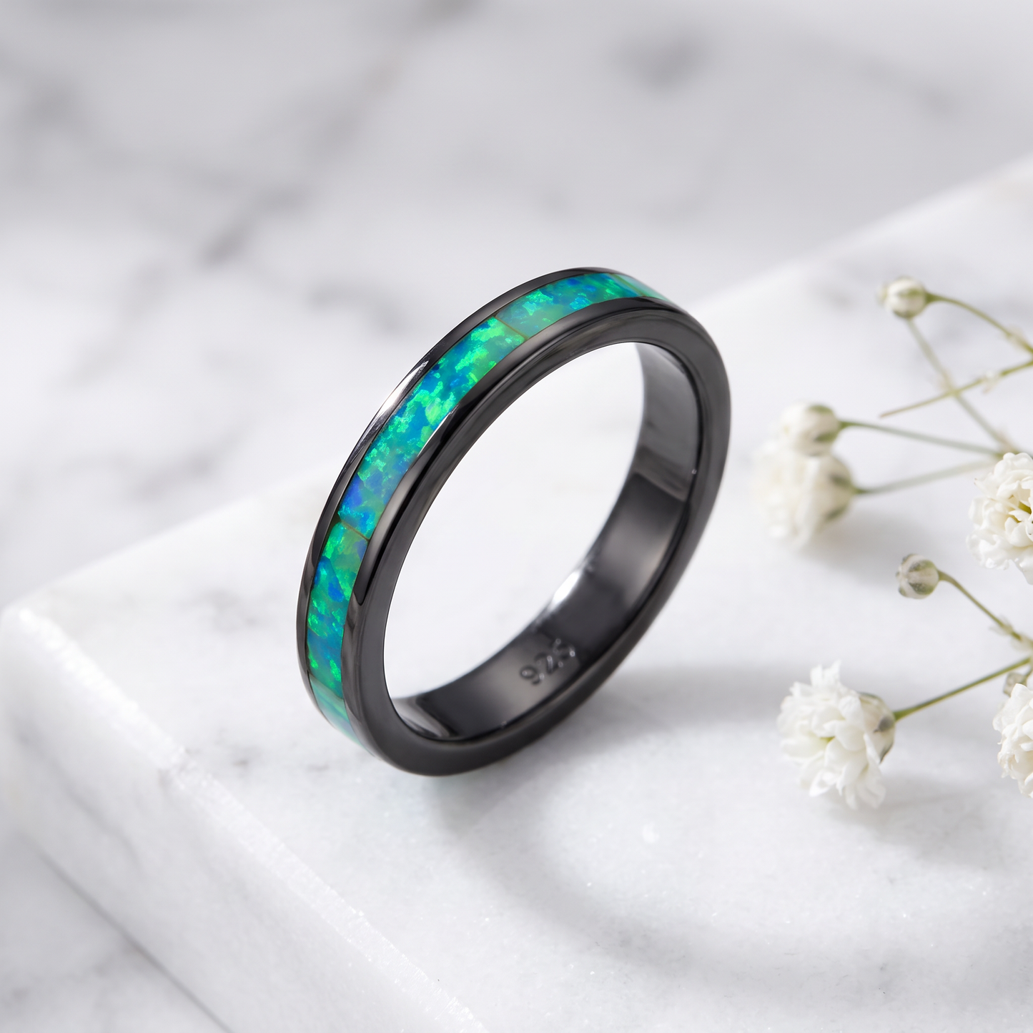 Sterling Silver Black Rhodium Plated Seamless Green Lab Opal Ring on marble