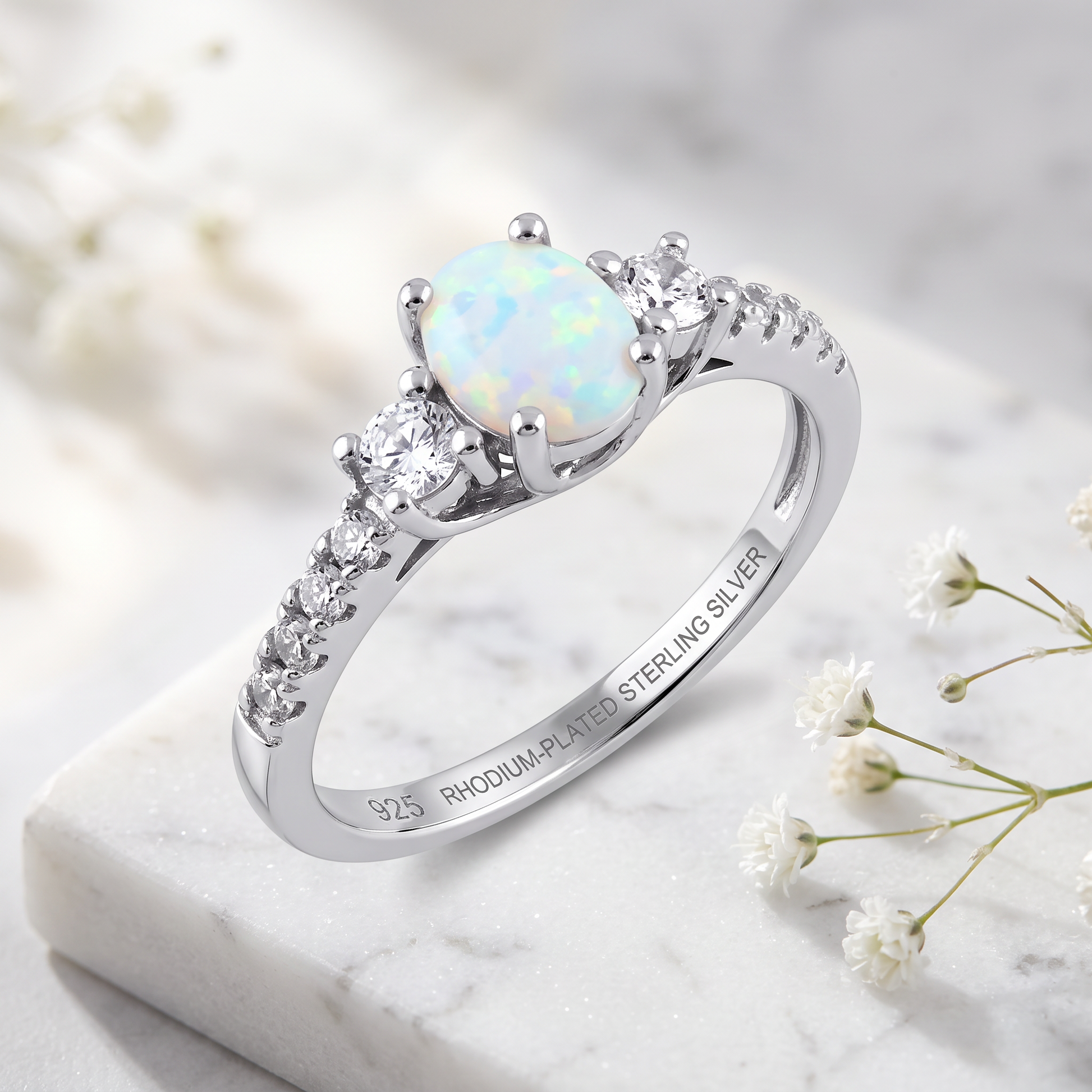 Sterling Silver Rose Gold Oval White Lab Opal CZ Ring on marble