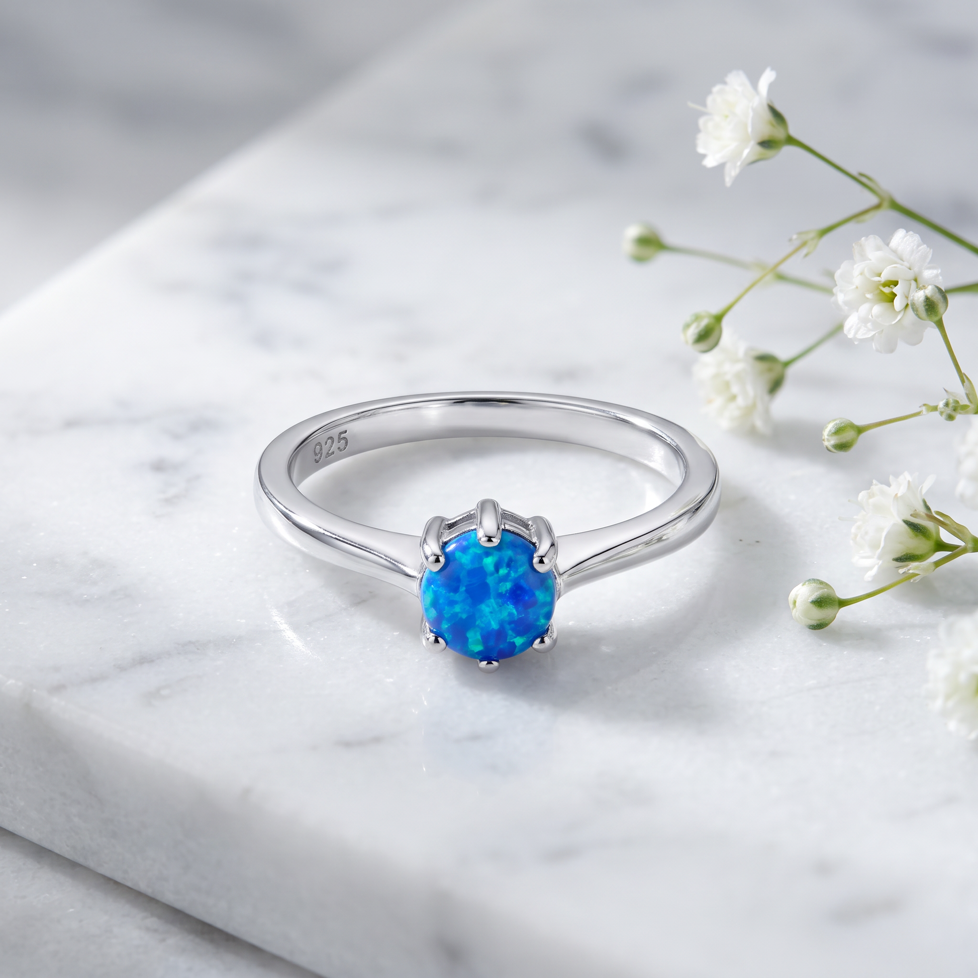 Sterling Silver Gold Plated Round Blue Lab Opal Ring on marble