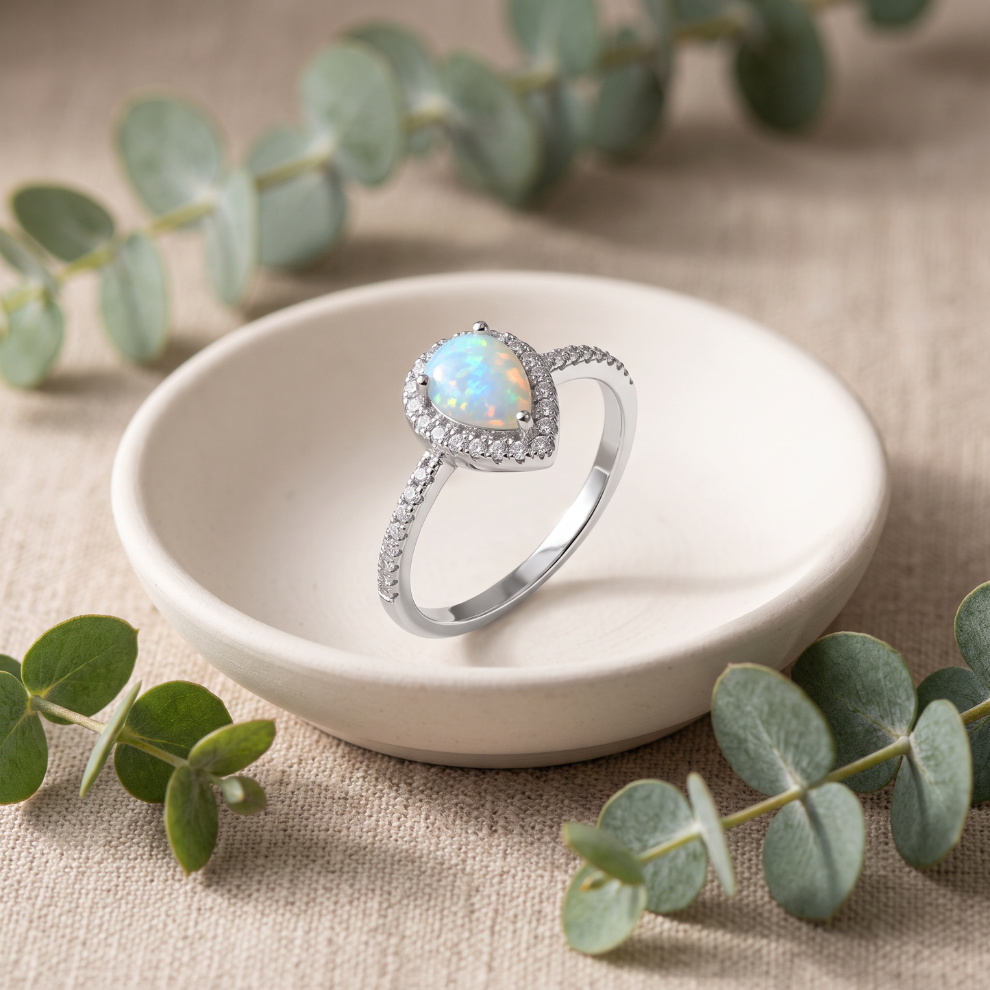 Sterling Silver White Lab Opal Tilted Pear Halo CZ Ring styled