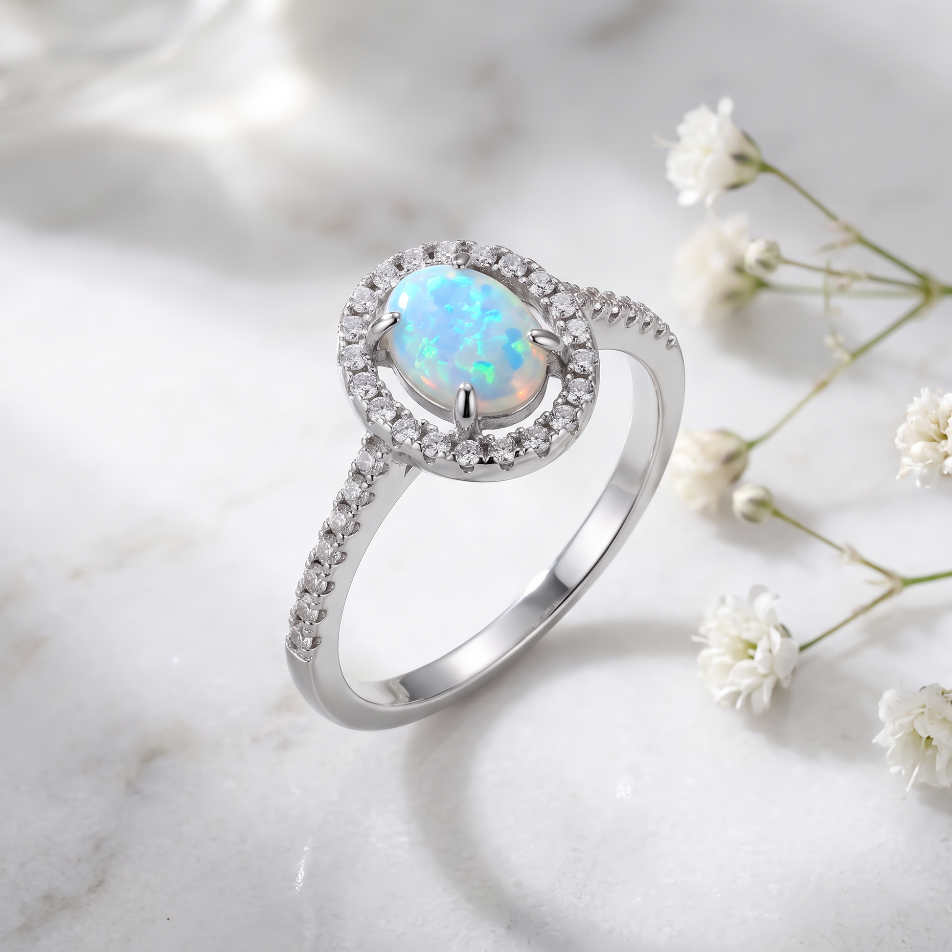 Sterling Silver White Lab Opal and Clear CZ Oval Halo Ring on marble