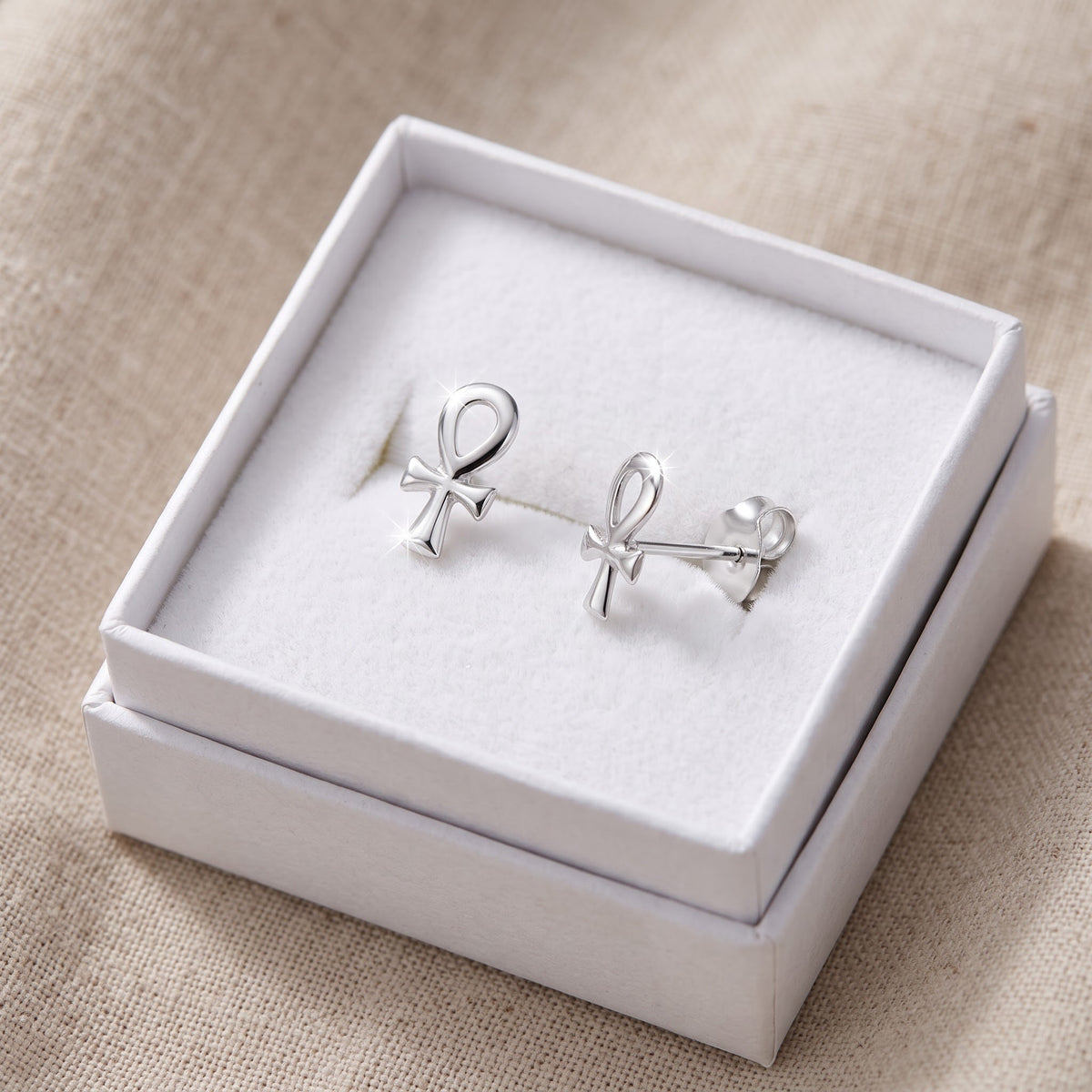 Sterling Silver Ankh Cross Stud Earrings - 7mm in a white gift box, ready to give