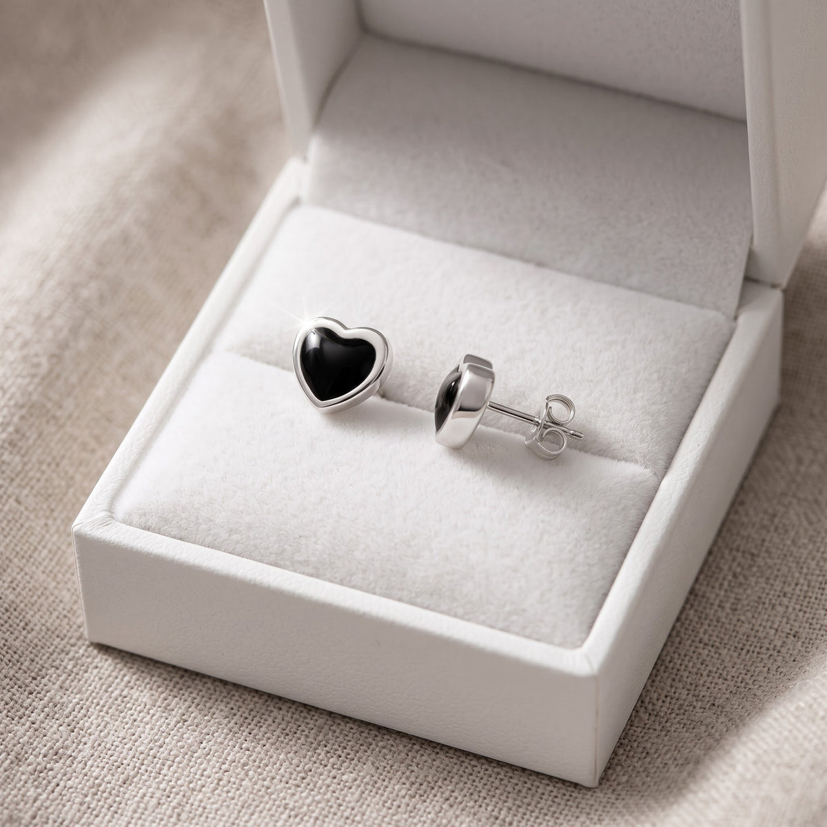 Sterling Silver Black Heart Stud Earrings in a white gift box, ready to give
