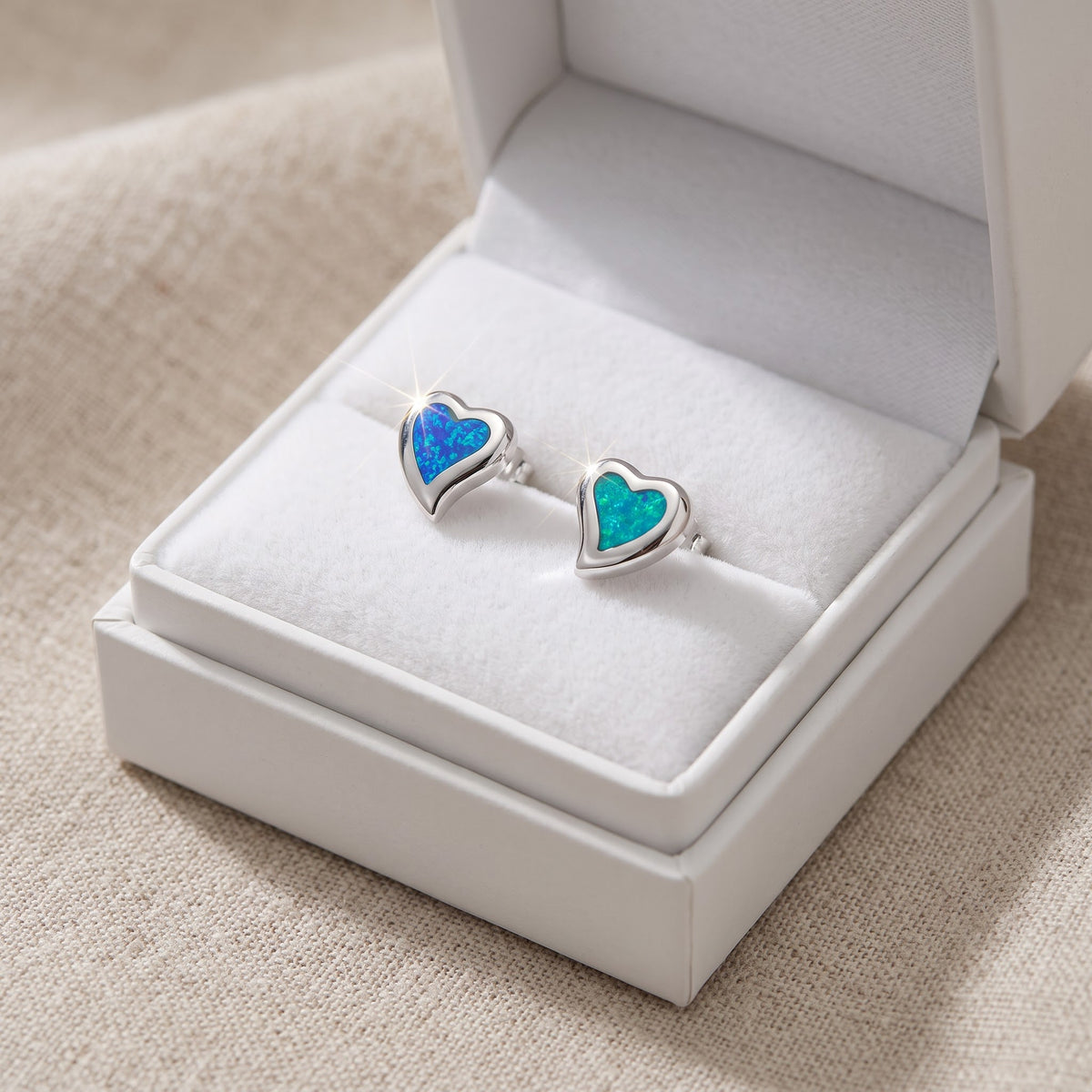 Sterling Silver Blue Created Opal Heart Stud Earrings, 12mm in a white gift box, ready to give
