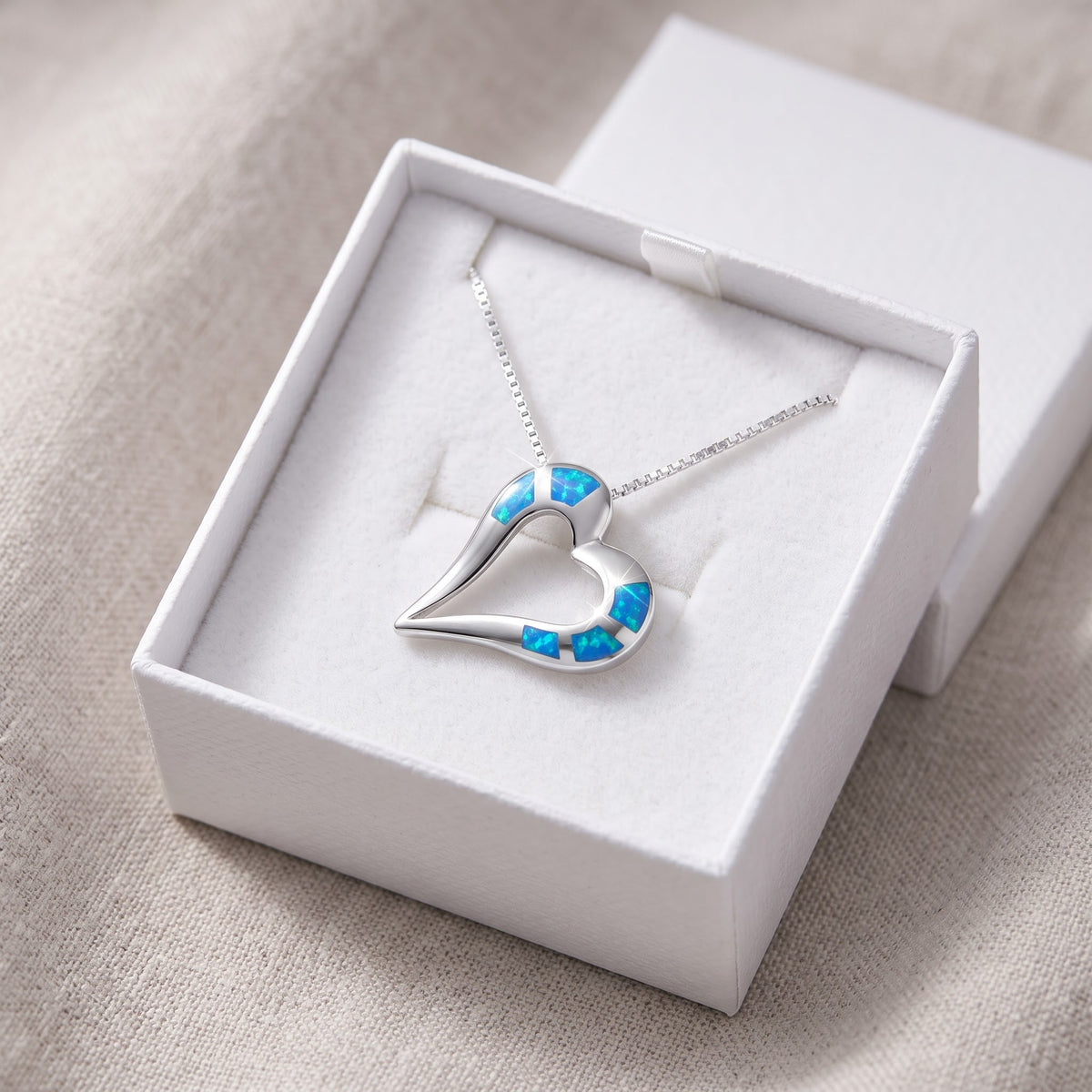 Sterling Silver Blue Created Opal Open Heart Necklace, 21mm in a white gift box, ready to give