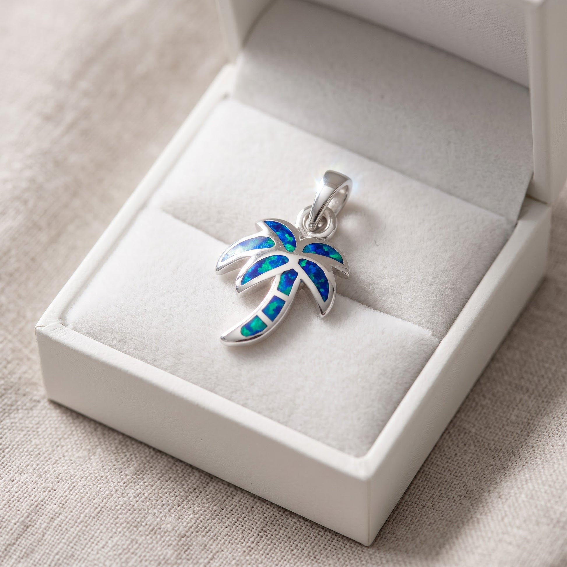 Sterling Silver Blue Created Opal Palm Tree Necklace - 17mm in a white gift box, ready to give