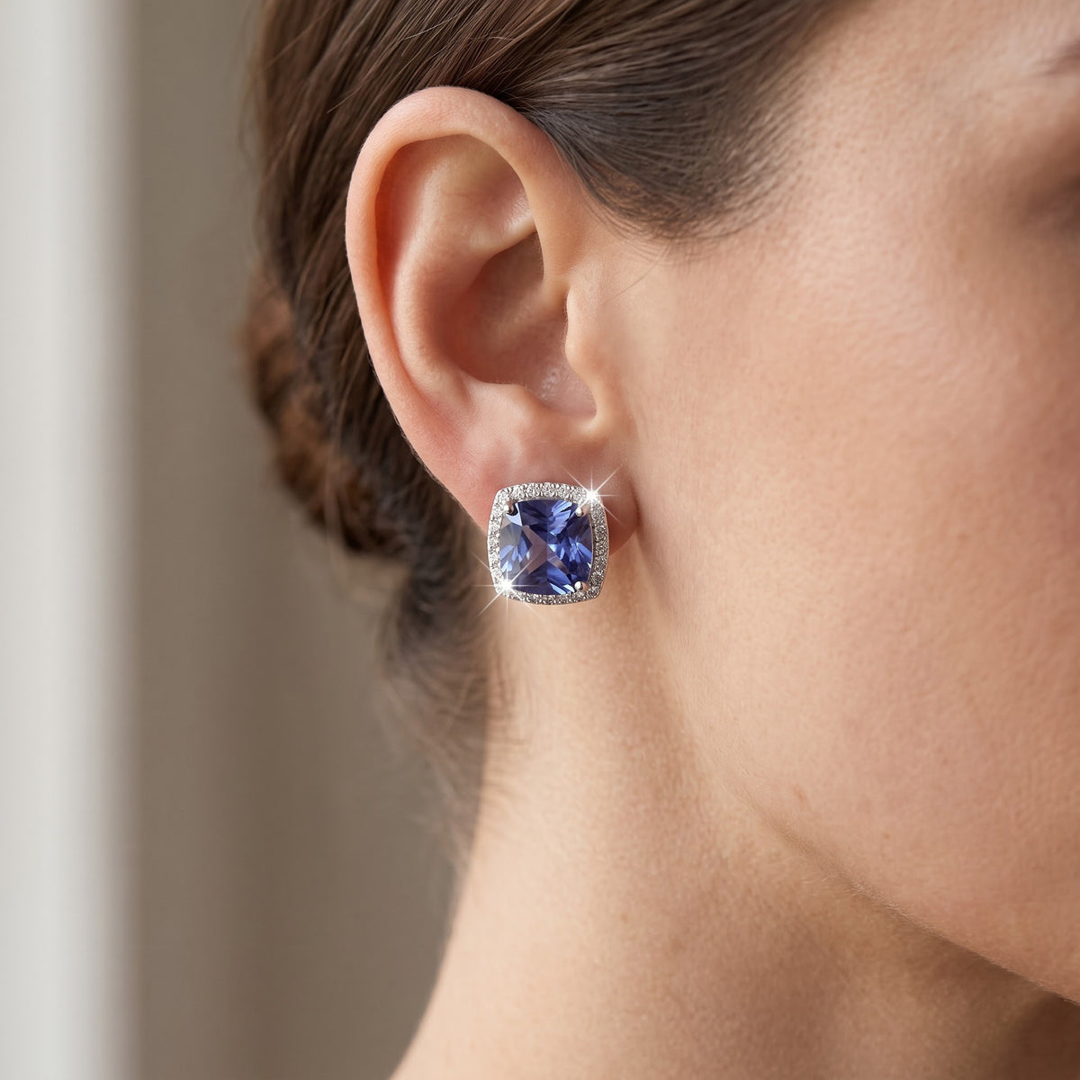 Sterling Silver Blue CZ Halo Stud Earrings, 11mm worn, lifestyle photo