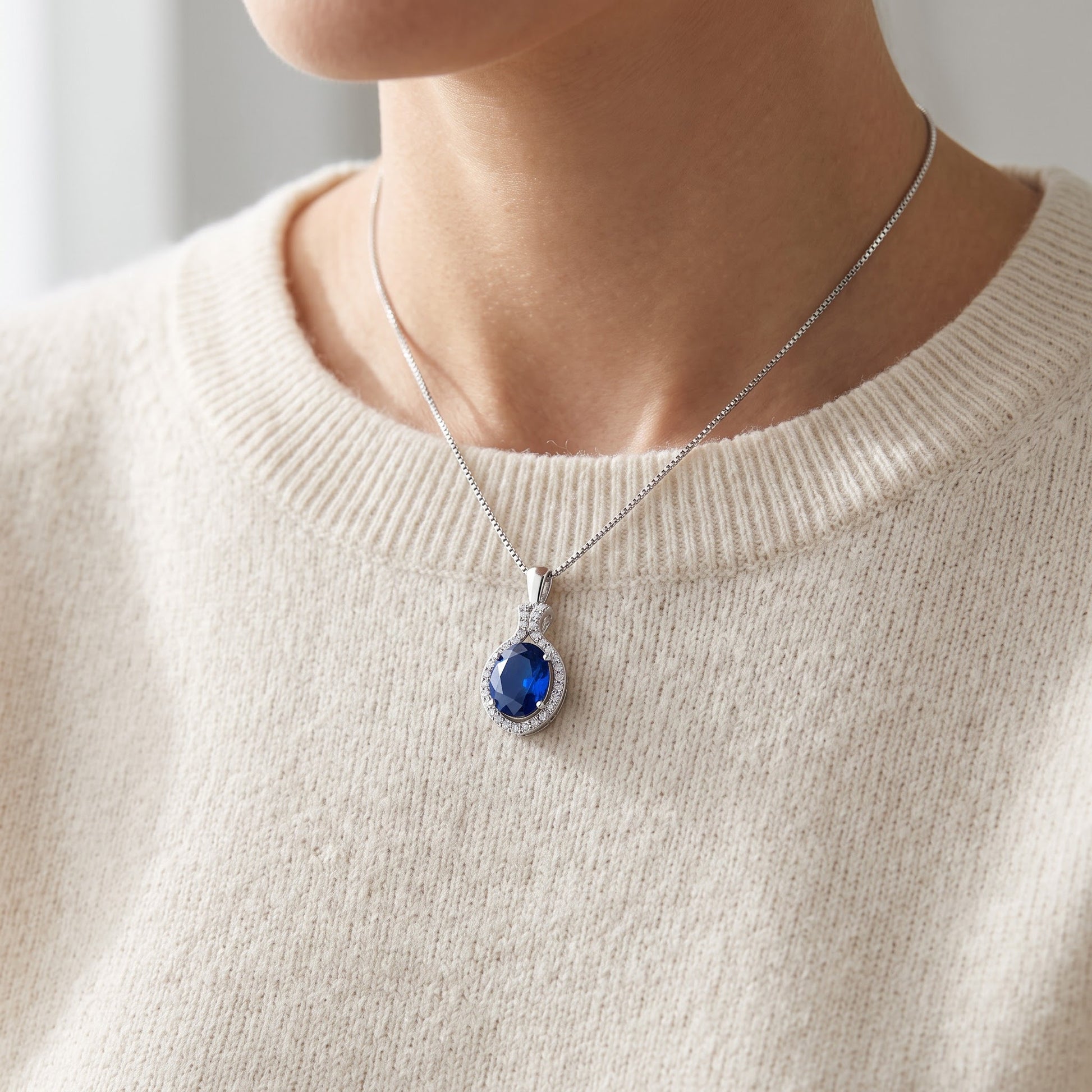 Sterling Silver Blue CZ Oval Drop Necklace worn, lifestyle photo