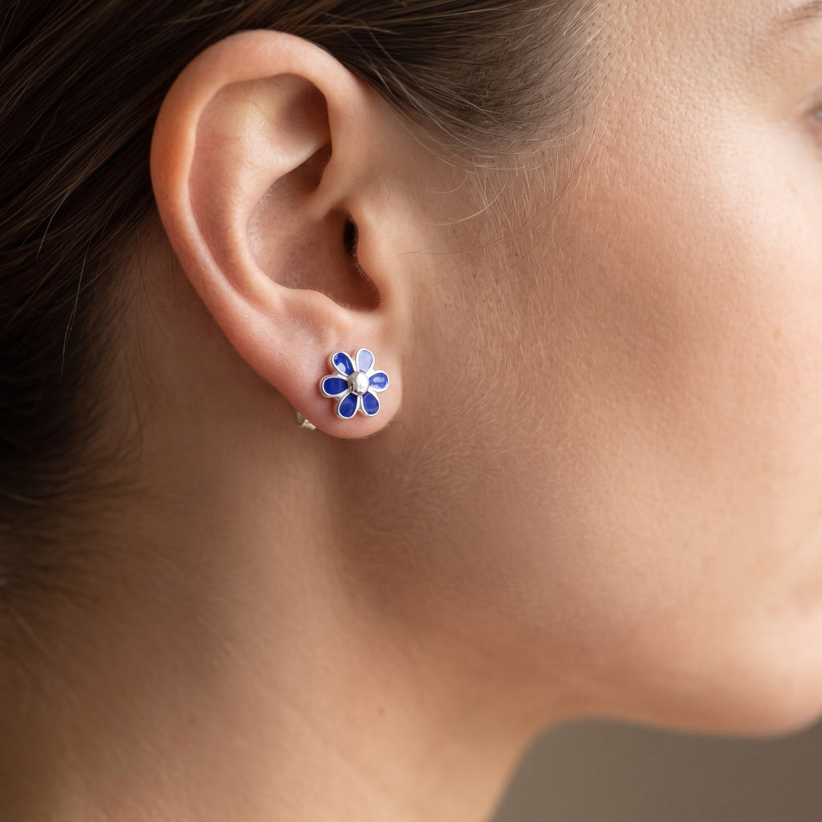 Sterling Silver Girls Dainty Blue Daisy Flower Stud Earrings worn, lifestyle photo