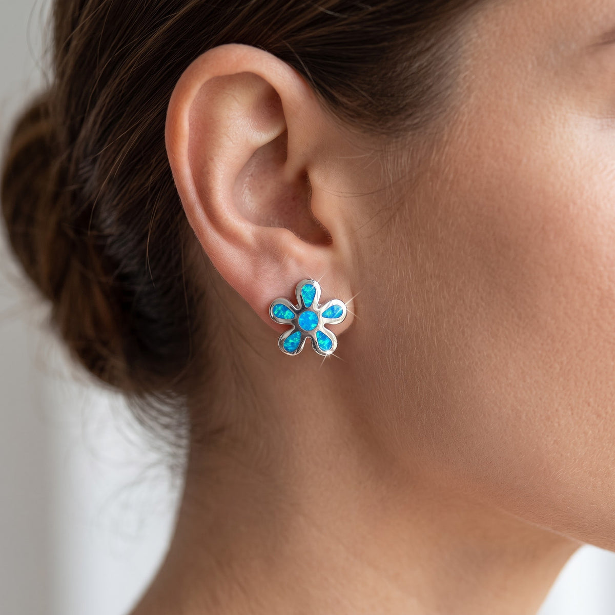 Sterling Silver Girls Blue Lab Opal Plumeria Flower Stud Earrings, 10mm worn, lifestyle photo