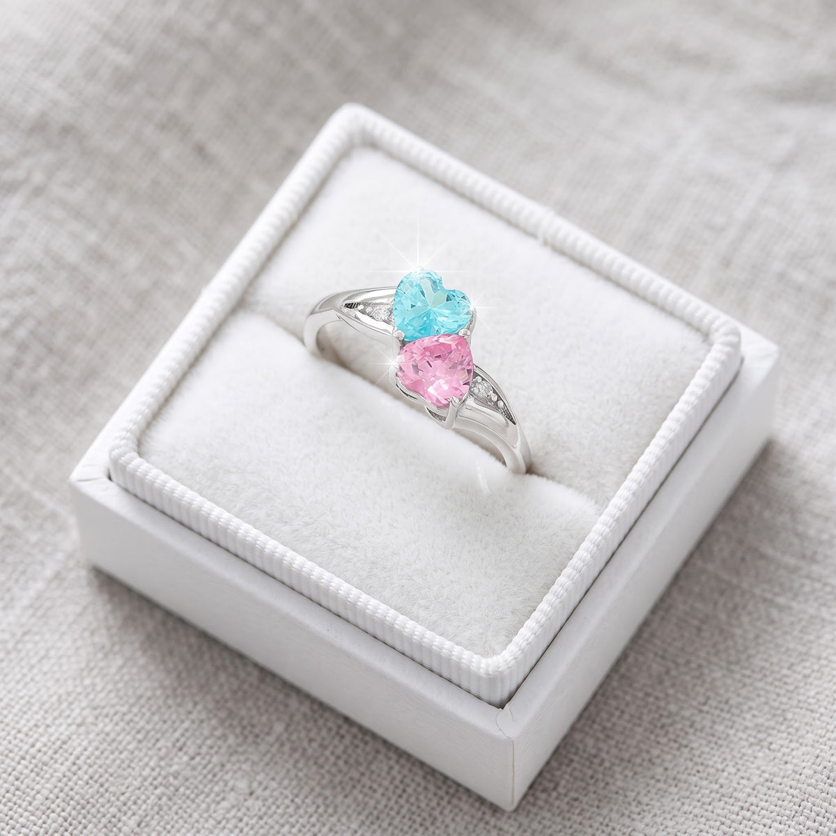 Sterling Silver Blue & Pink CZ Double Heart Ring in a white gift box, ready to give
