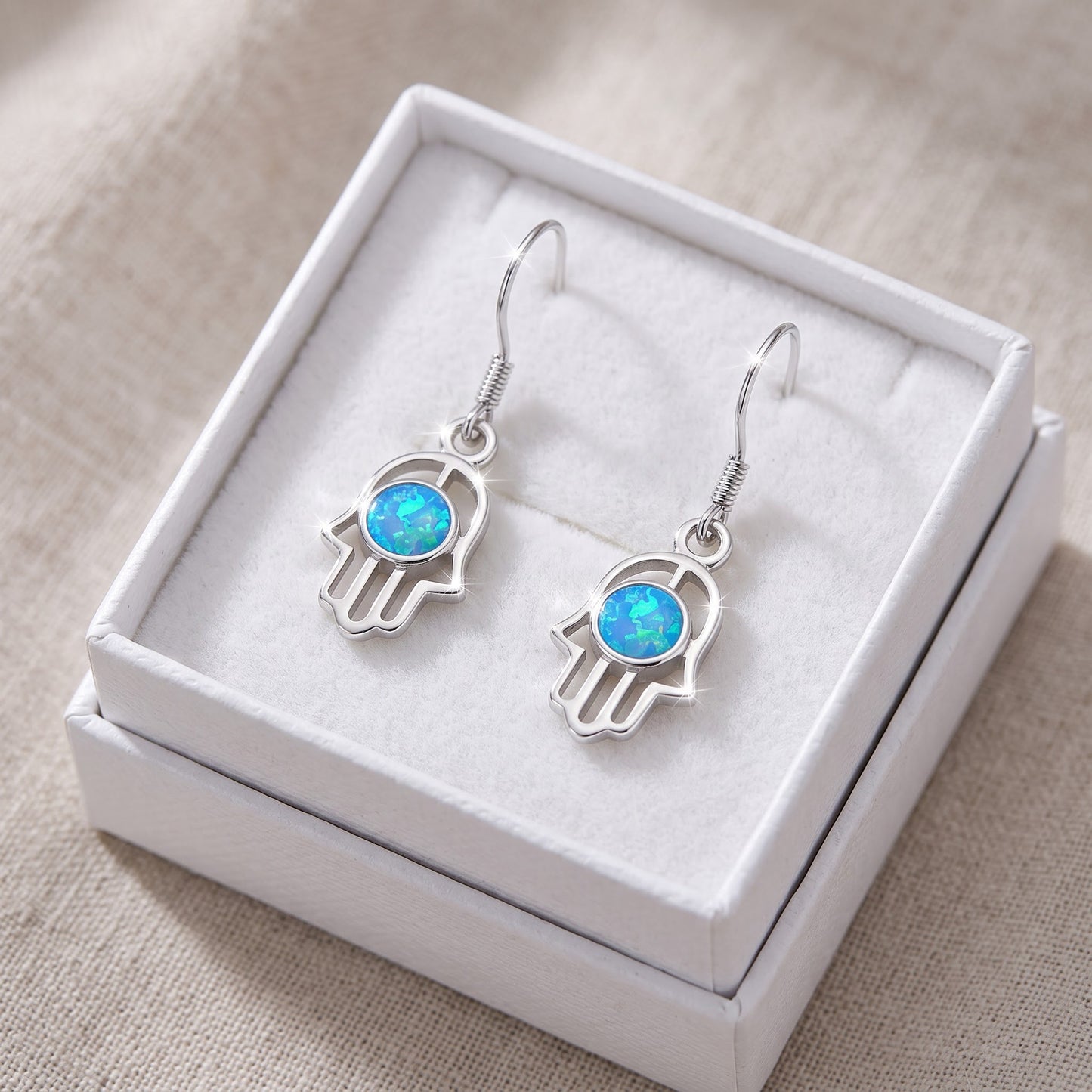 Sterling Silver Girls Blue Created Opal Hamsa Hand of God Fish hook Earrings in a white gift box, ready to give
