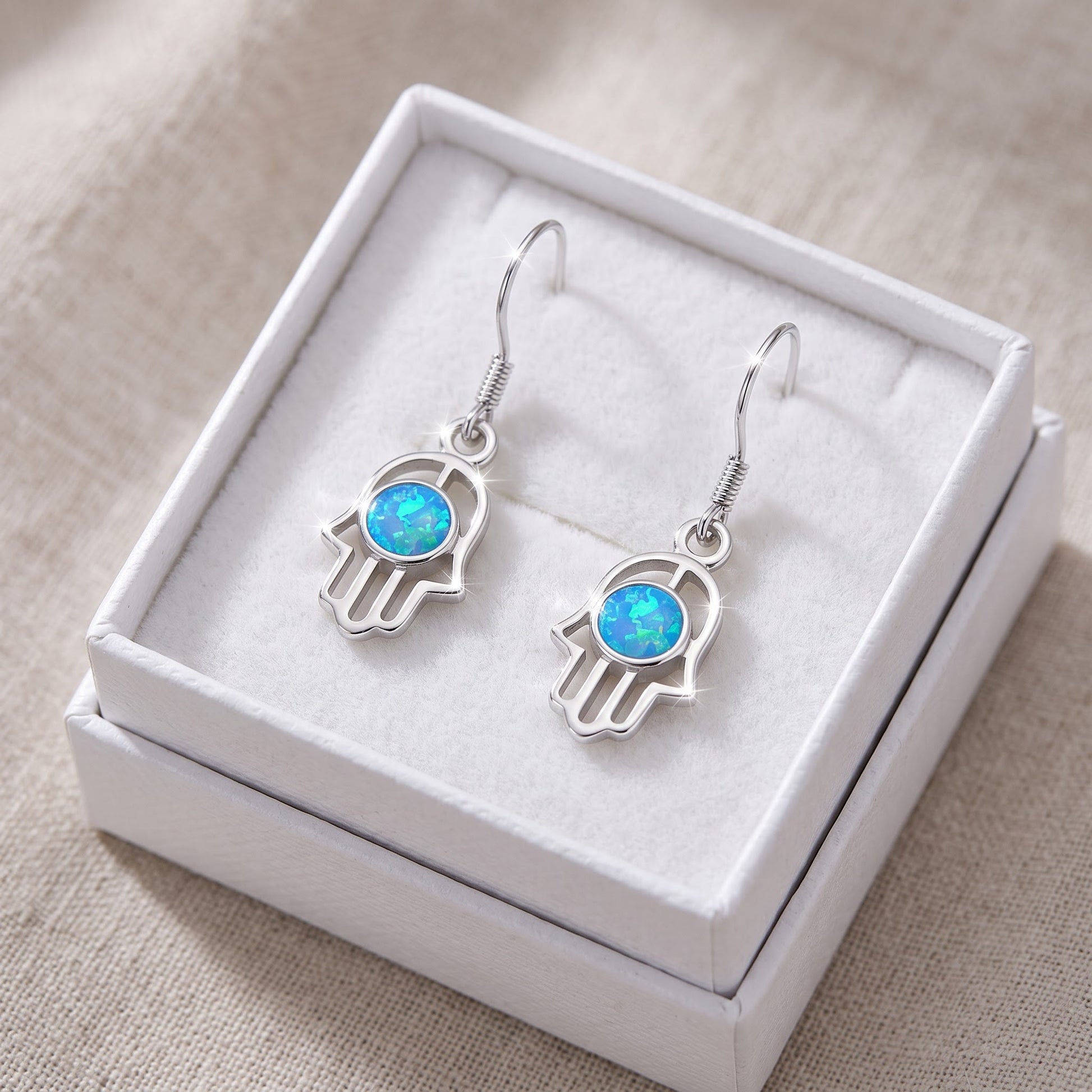 Sterling Silver Girls Blue Created Opal Hamsa Hand of God Fish hook Earrings in a white gift box, ready to give