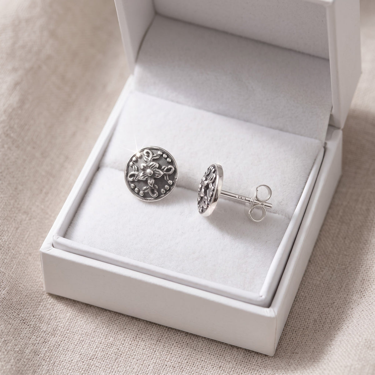 Sterling Silver Boho filigree Flower Stud Earrings in a white gift box, ready to give