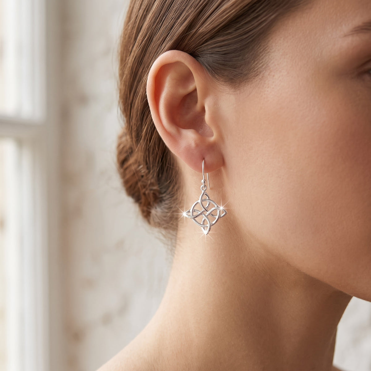 Sterling Silver Celtic Triquetra Drop Earrings worn, lifestyle photo