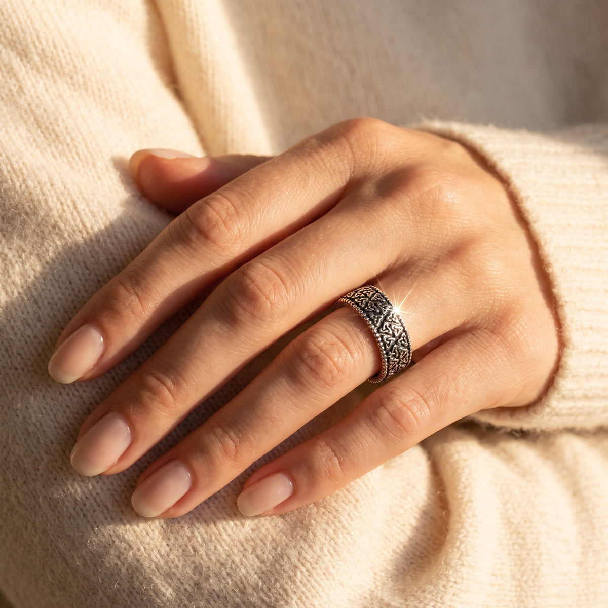 Sterling Silver Celtic Triquetra Eternity Ring worn, lifestyle photo