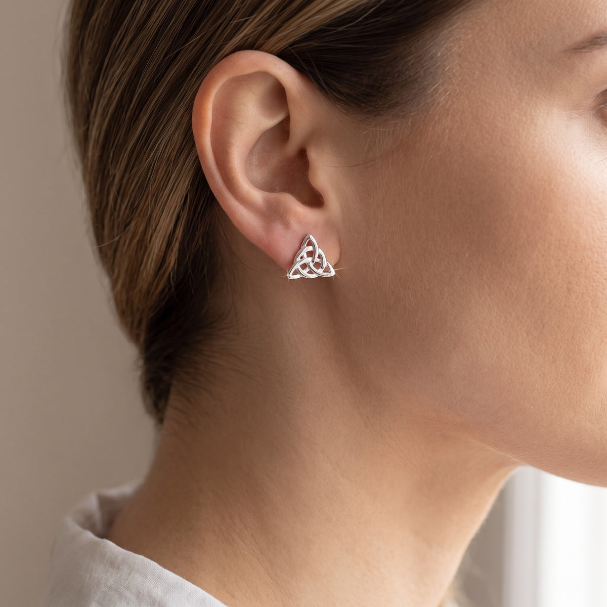 Sterling Silver Celtic Triquetra Stud Earrings, 7mm worn, lifestyle photo