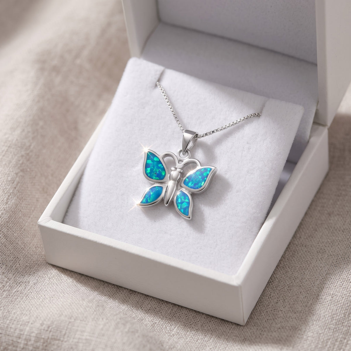 Sterling Silver Created Blue Opal Butterfly Necklace, 18mm in a white gift box, ready to give