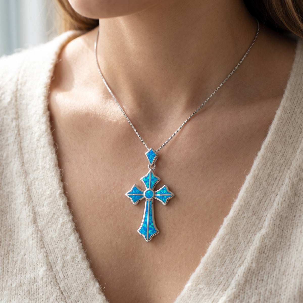Sterling Silver Created Blue Opal Cross Necklace, 18 Inch Chain worn, lifestyle photo