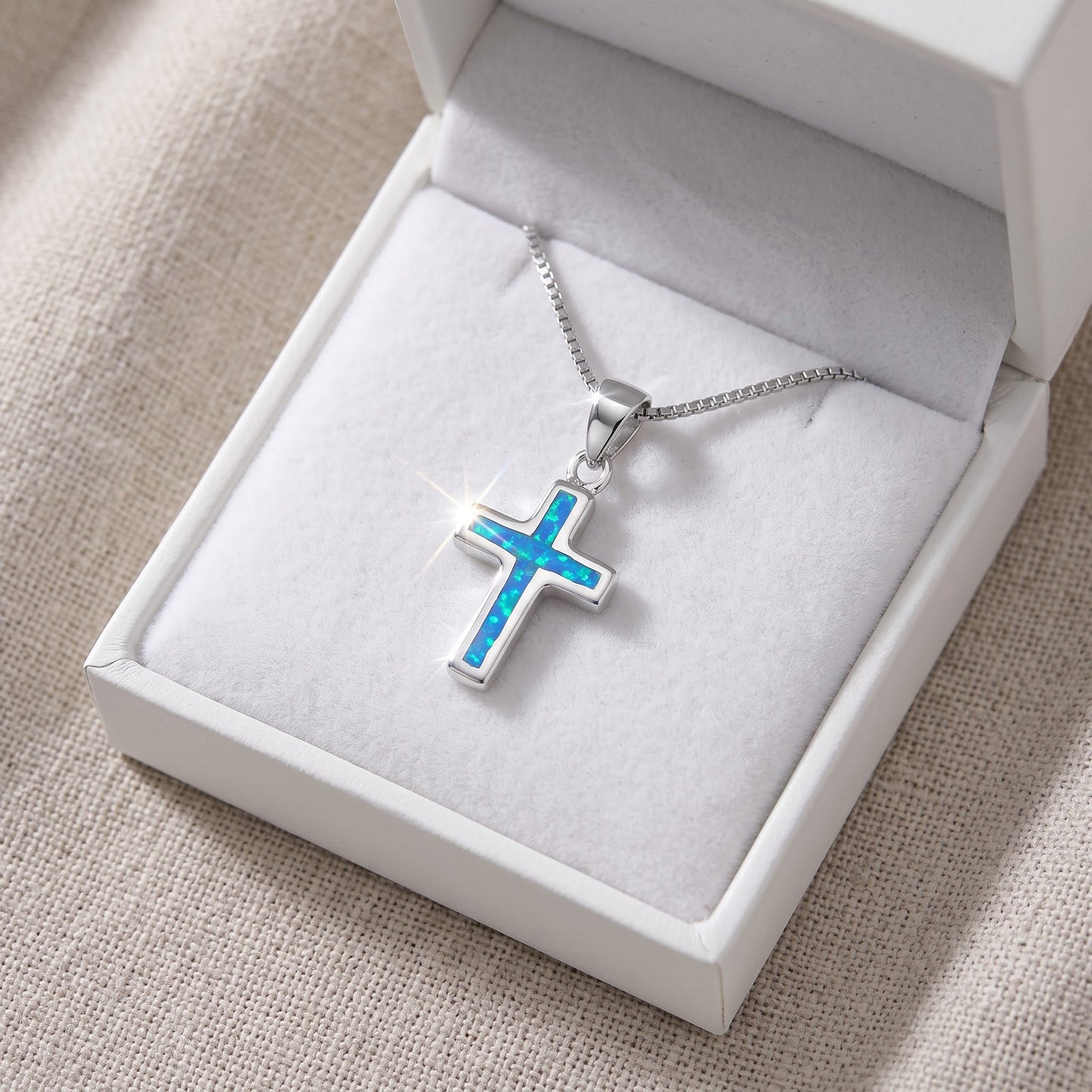 Sterling Silver Created Blue Opal Cross Necklace, 18" in a white gift box, ready to give