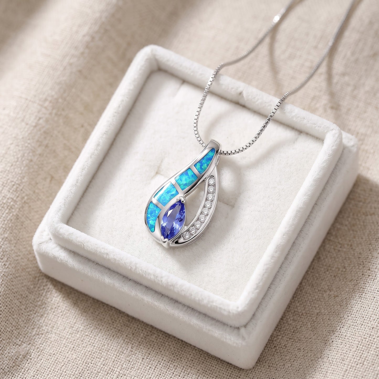 Sterling Silver Created Blue Opal CZ Tear Drop Necklace, 18" in a white gift box, ready to give