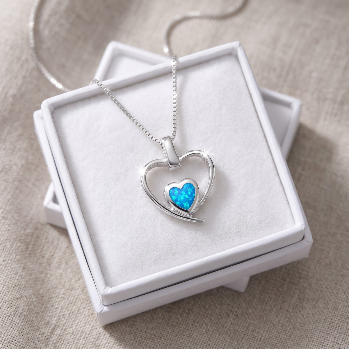 Sterling Silver Created Blue Opal Double Heart Necklace, 18 Inch Chain in a white gift box, ready to give
