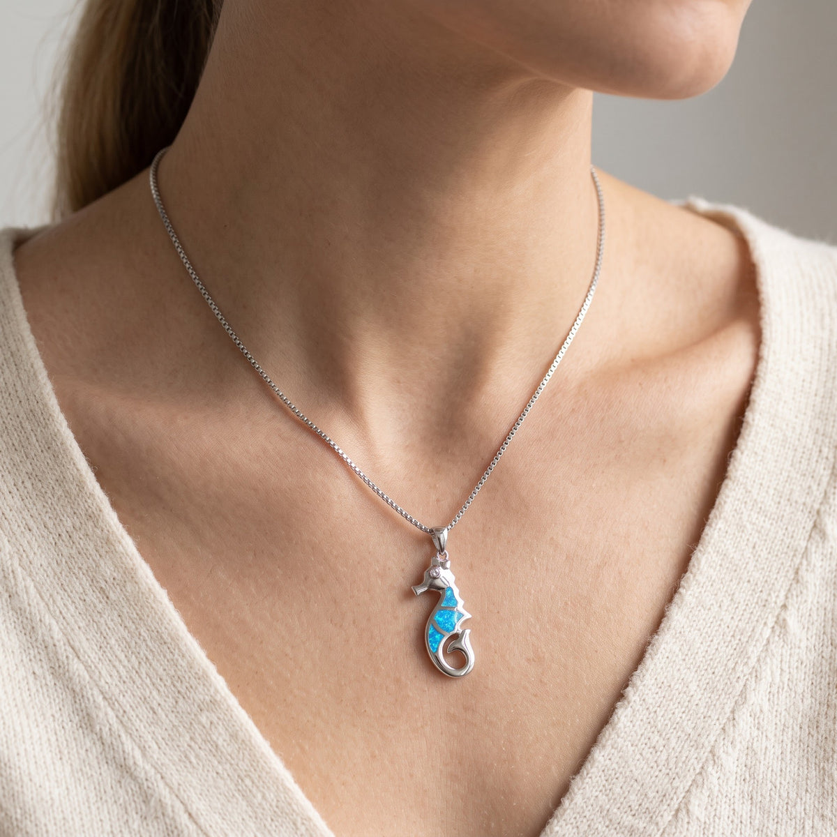 Sterling Silver Created Blue Opal Seahorse Necklace, 18 Inch Chain worn, lifestyle photo
