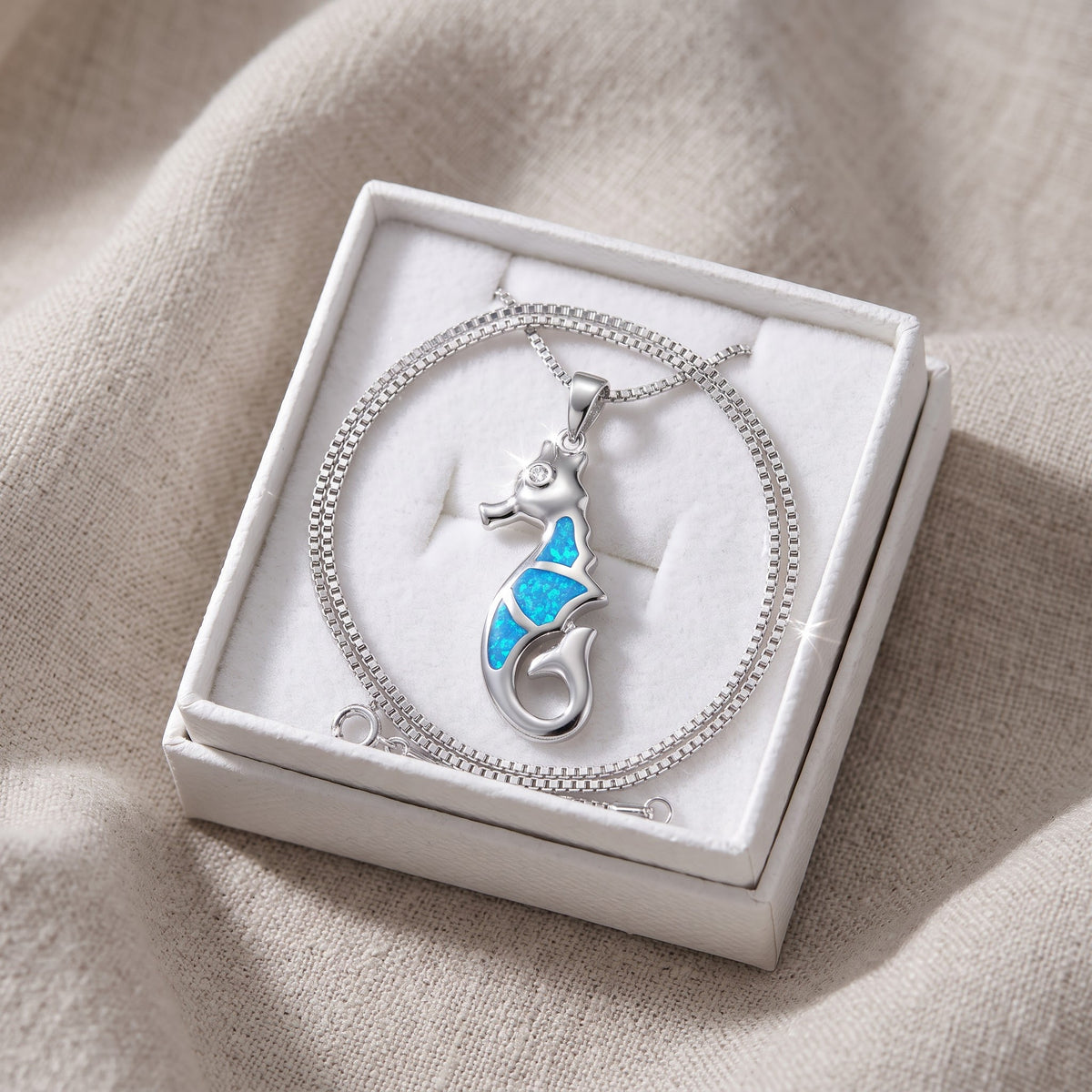 Sterling Silver Created Blue Opal Seahorse Necklace, 18 Inch Chain in a white gift box, ready to give