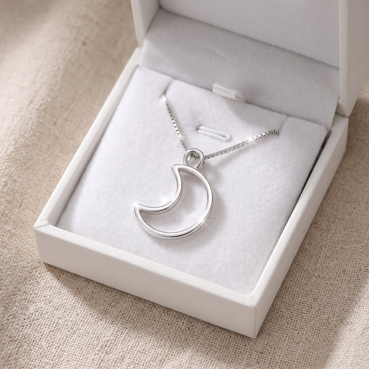 Sterling Silver Crescent Moon Necklace in a white gift box, ready to give