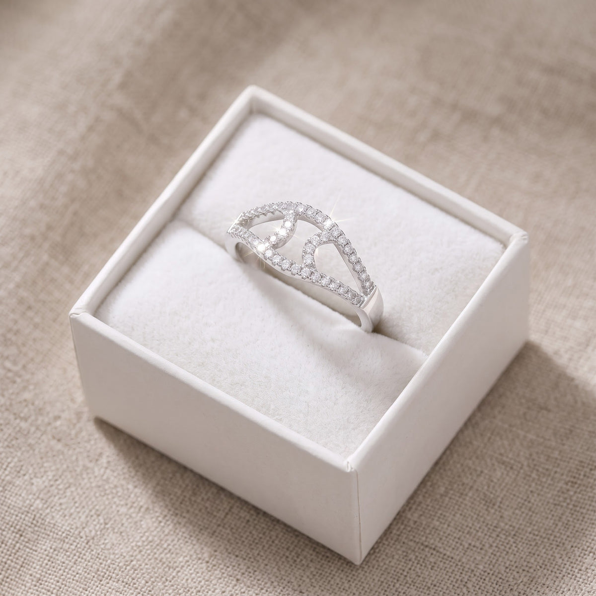 Sterling Silver CZ Abstract Evil Eye Ring in a white gift box, ready to give
