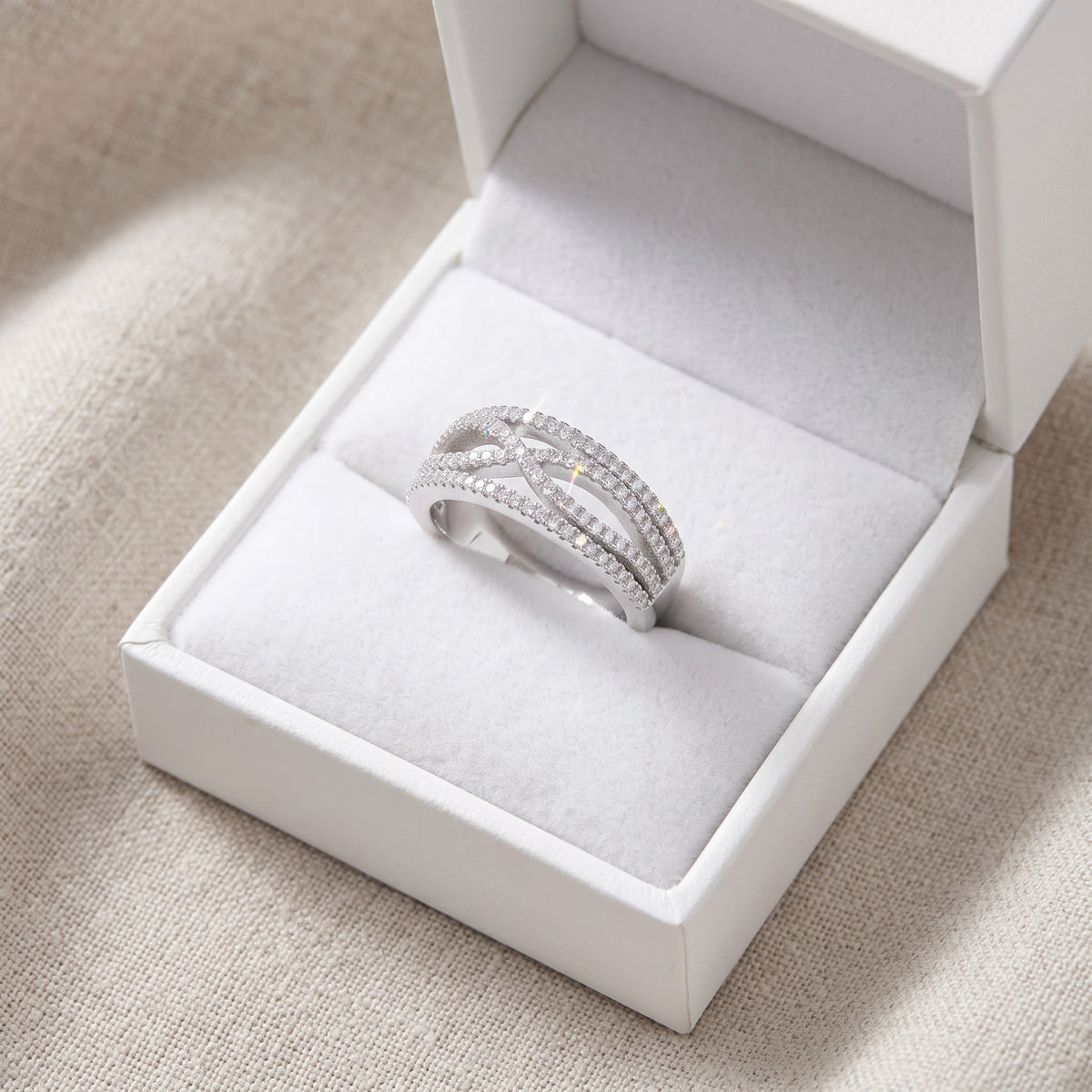 Sterling Silver CZ Artsy Infinity Statement Ring in a white gift box, ready to give