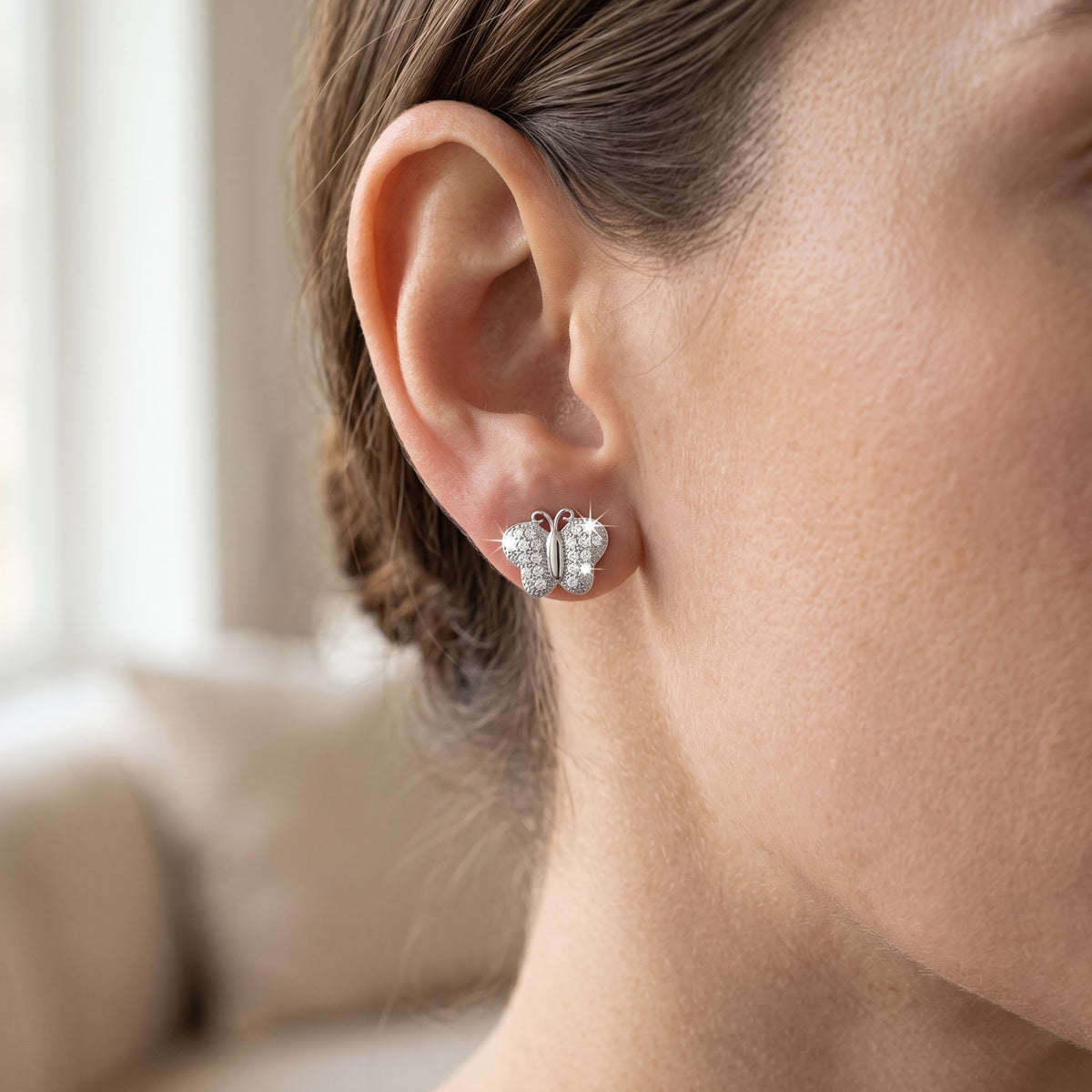 Sterling Silver CZ Butterfly Stud Earrings, 7mm worn, lifestyle photo