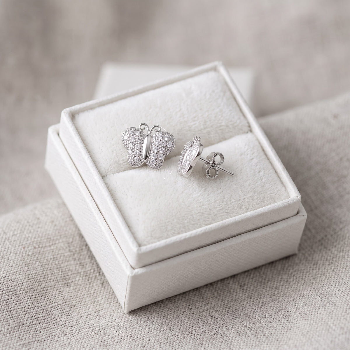 Sterling Silver CZ Butterfly Stud Earrings, 7mm in a white gift box, ready to give