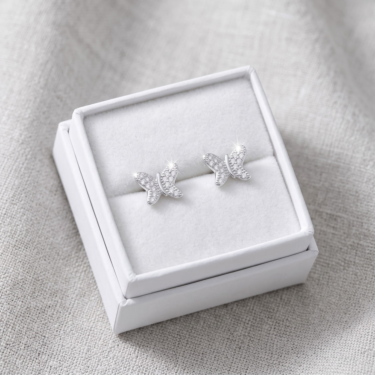 Sterling Silver CZ Butterfly Stud Earrings, 9mm in a white gift box, ready to give