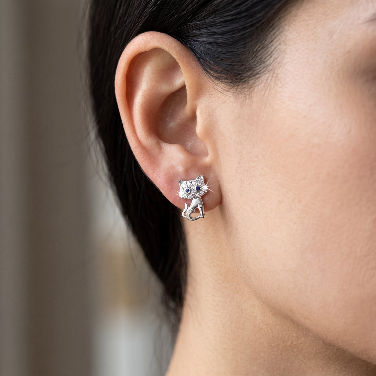 Sterling Silver CZ Cat Stud Earrings worn, lifestyle photo