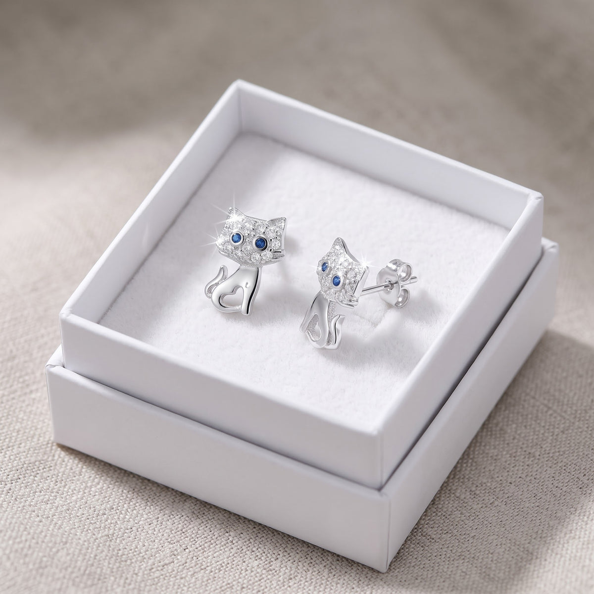 Sterling Silver CZ Cat Stud Earrings in a white gift box, ready to give