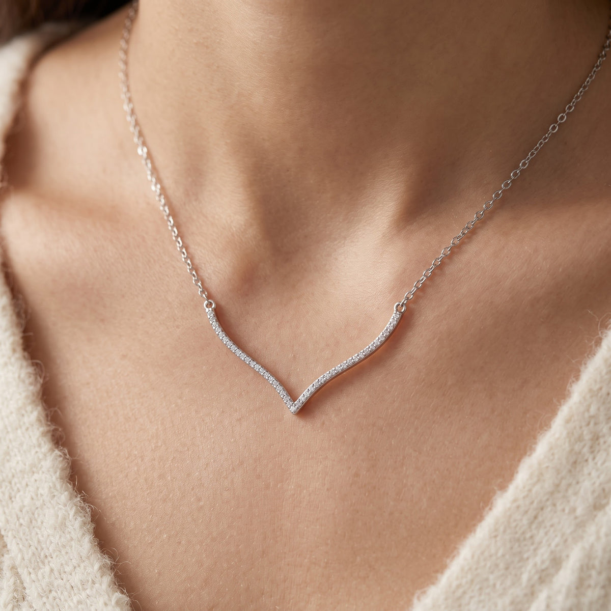 Sterling Silver CZ Curved Wishbone V Necklace worn, lifestyle photo