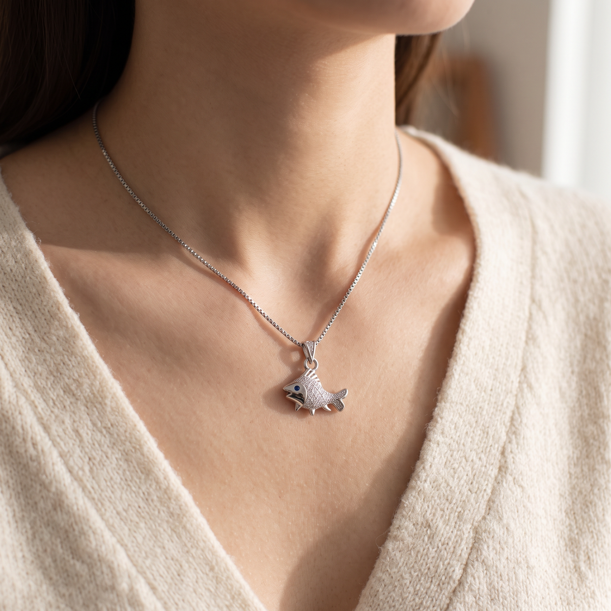 Sterling Silver CZ Fish Necklace worn, lifestyle photo