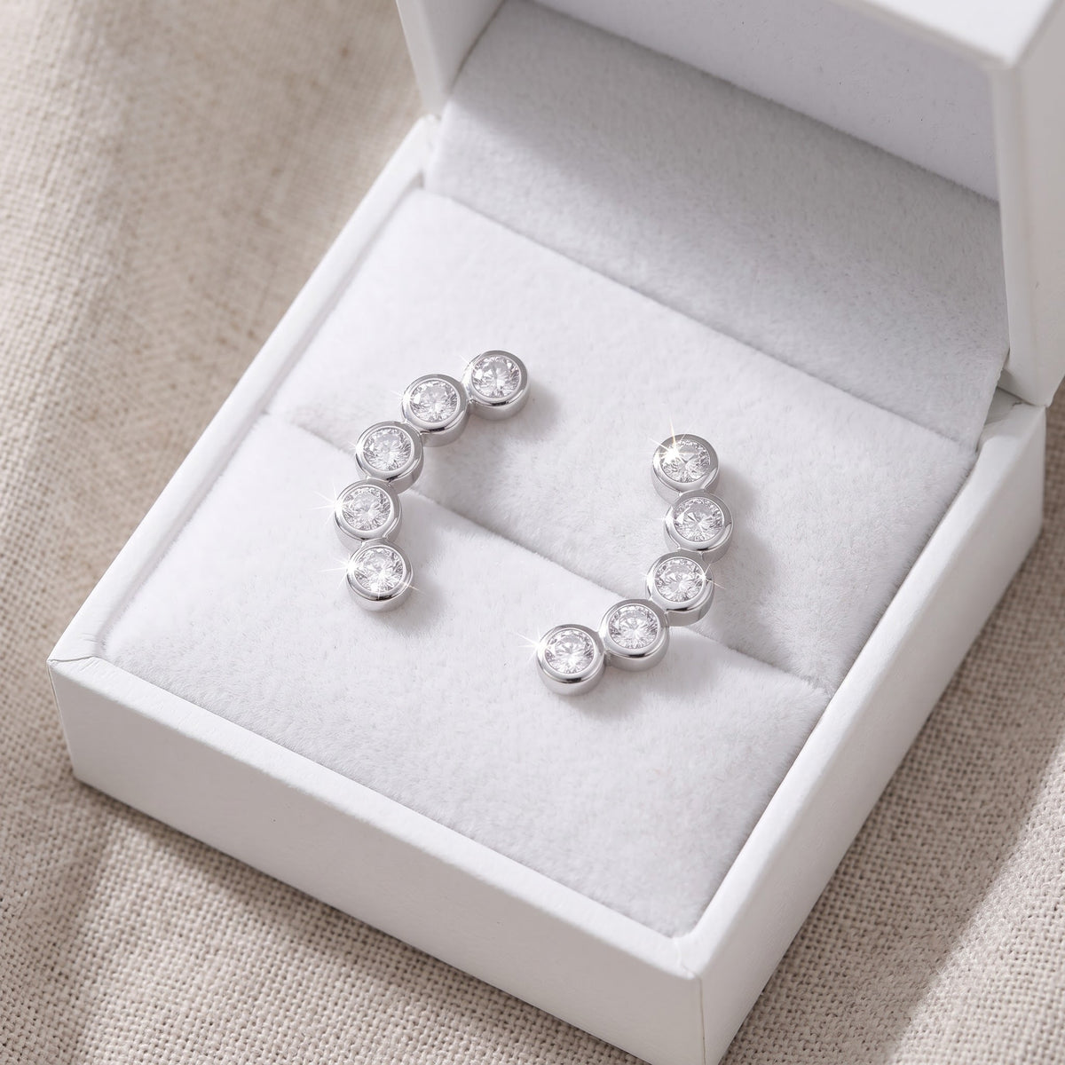 Sterling Silver CZ Half Ear Crawler Stud Earrings in a white gift box, ready to give