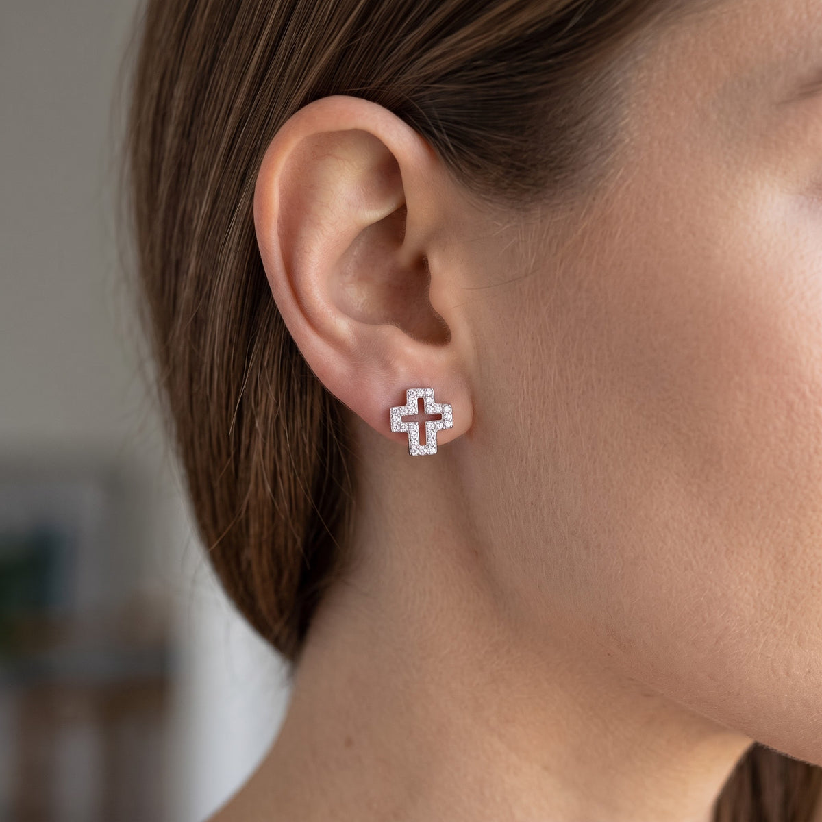 Sterling Silver CZ Hollow Cross Stud Earrings worn, lifestyle photo