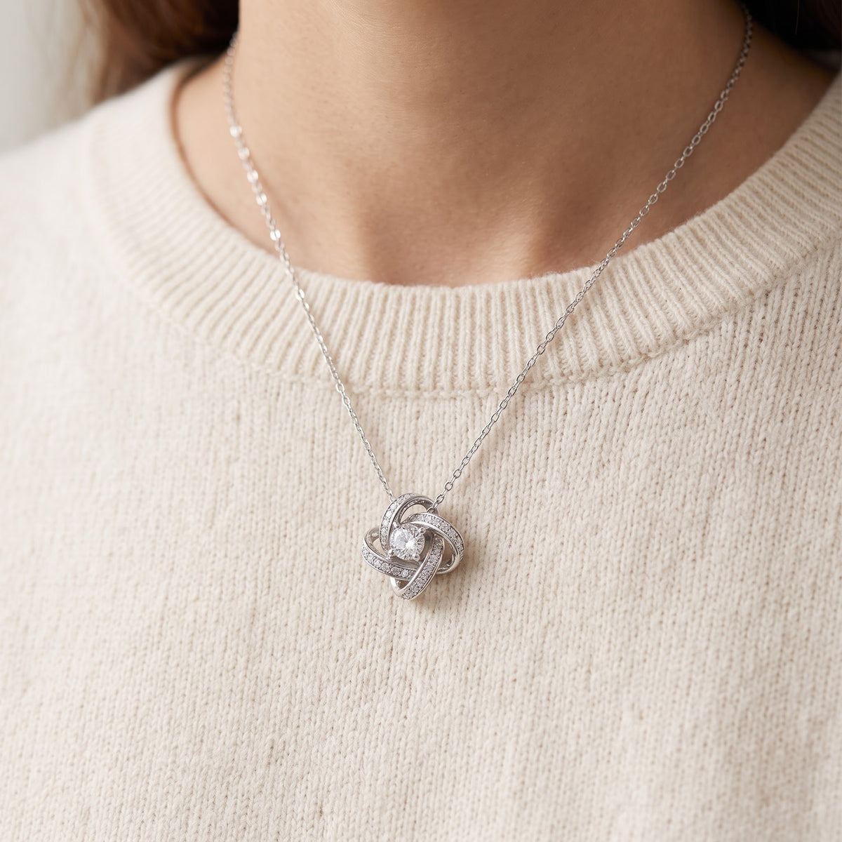 Sterling Silver CZ Infinity Knot Necklace worn, lifestyle photo