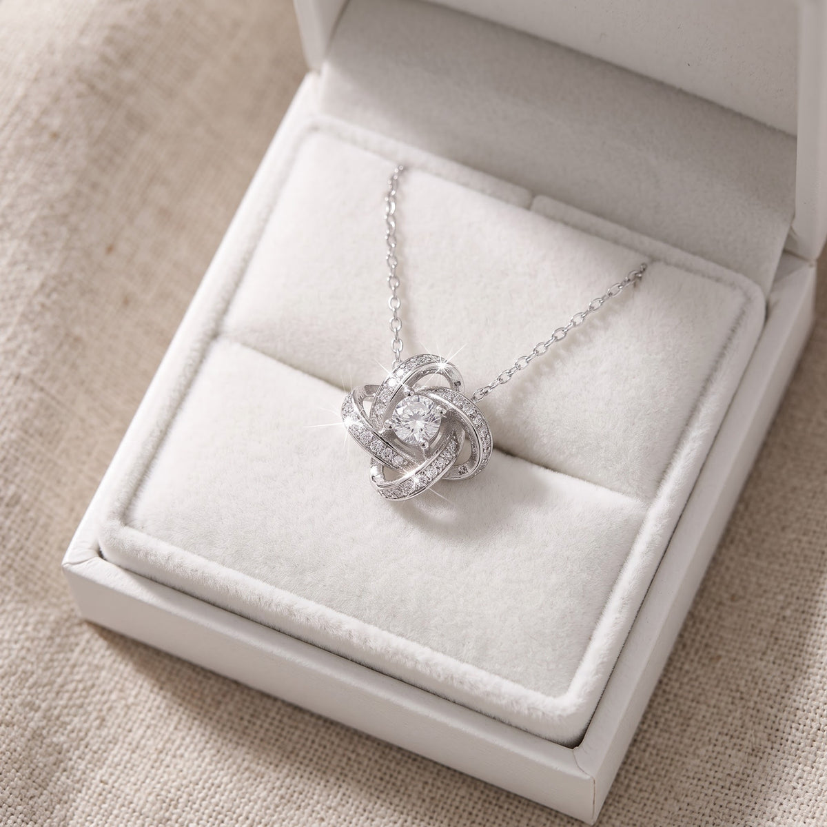 Sterling Silver CZ Infinity Knot Necklace in a white gift box, ready to give