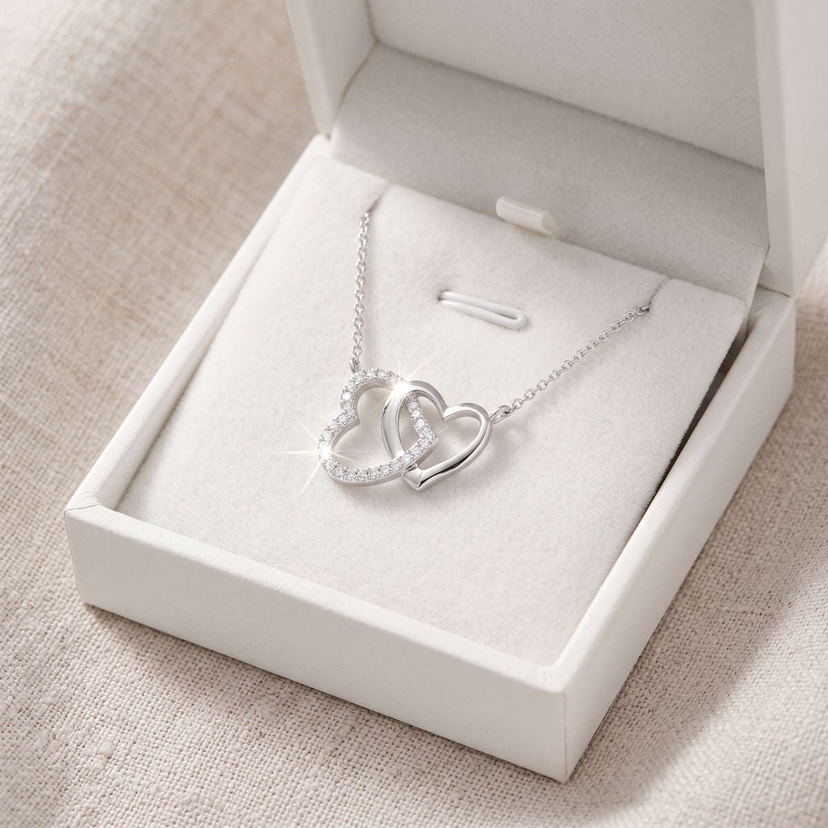 Sterling Silver CZ Interlocking Hearts Necklace, 18" in a white gift box, ready to give
