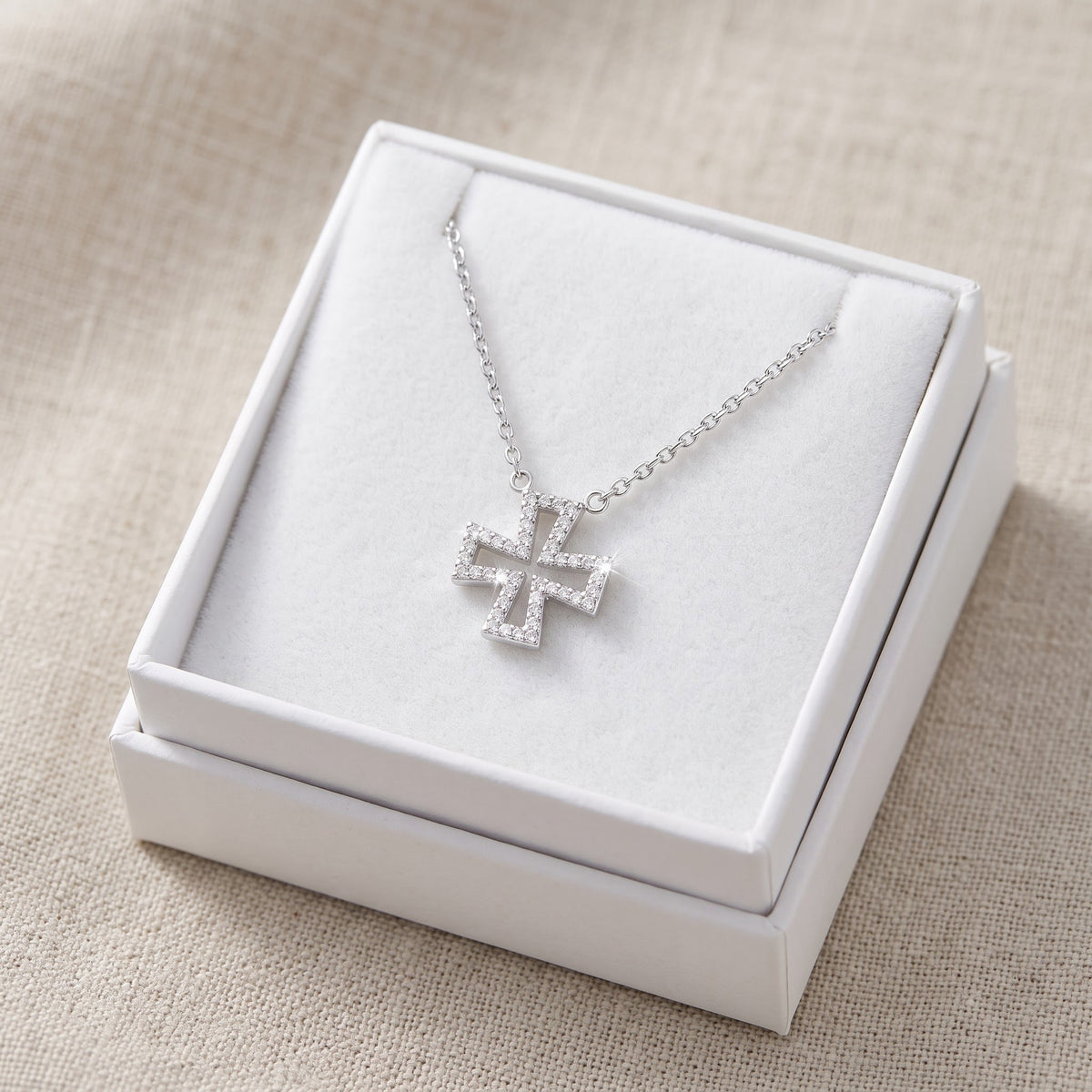 Sterling Silver CZ Iron Cross Necklace 18" in a white gift box, ready to give
