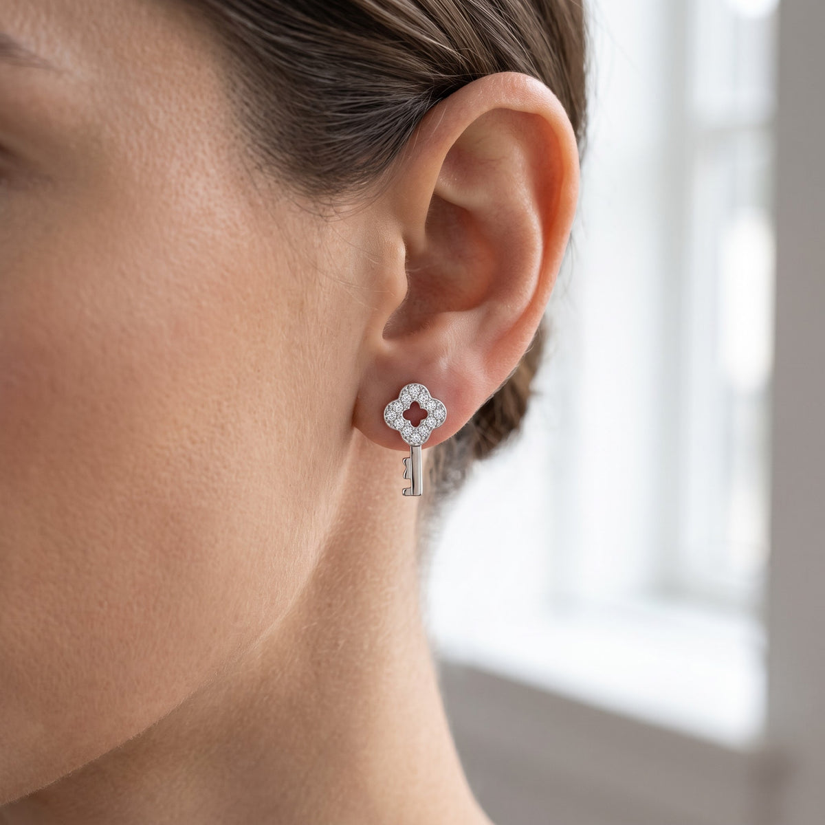 Sterling Silver CZ Key Stud Earrings worn, lifestyle photo