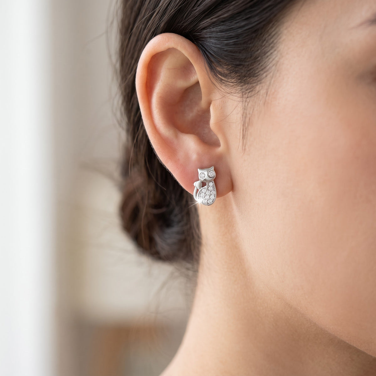 Sterling Silver CZ Kitty Stud Earrings worn, lifestyle photo