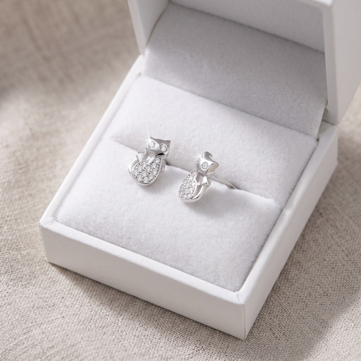 Sterling Silver CZ Kitty Stud Earrings in a white gift box, ready to give