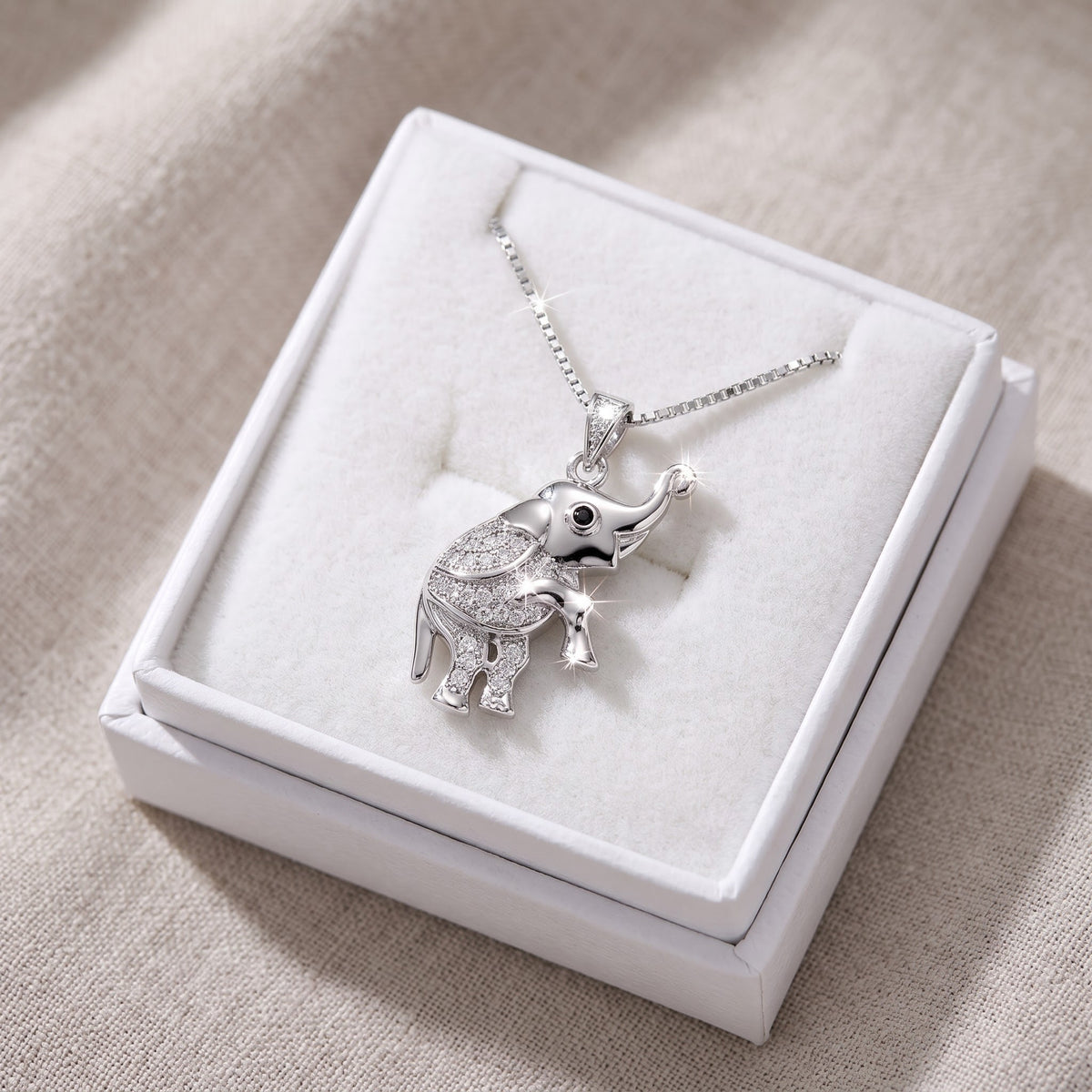 Sterling Silver CZ Lucky Elephant Necklace in a white gift box, ready to give